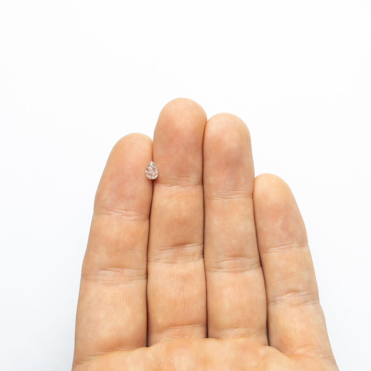 The 0.46ct 5.85x3.80x2.65mm SI2 Fancy Light Brownish Pink Pear Brilliant 🇦🇺 24118-01 by East London jeweller Rachel Boston | Discover our collections of unique and timeless engagement rings, wedding rings, and modern fine jewellery.