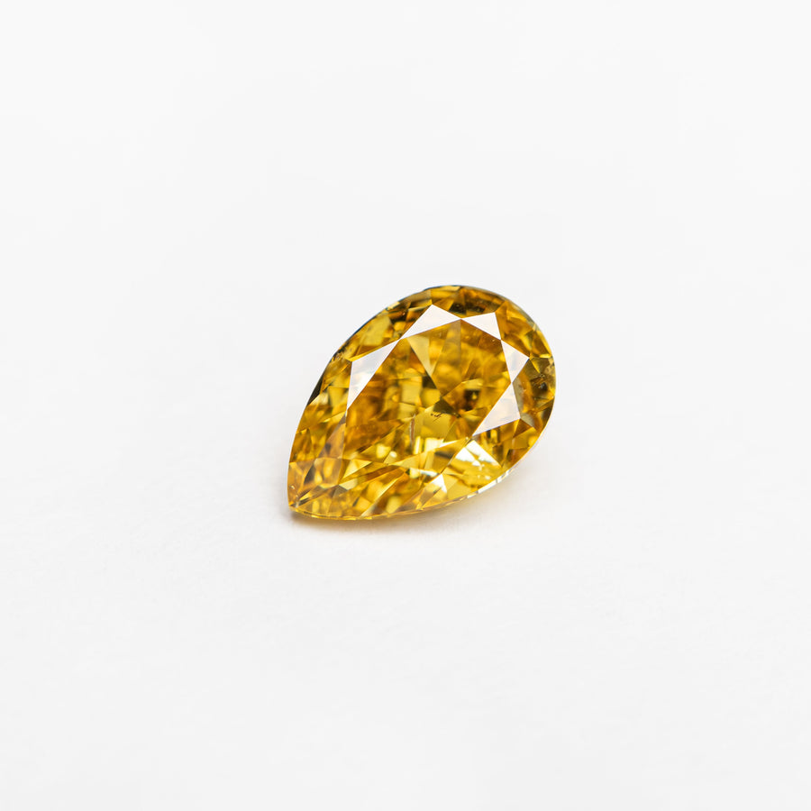 The 0.50ct 6.13x4.13x2.67mm SI2 Fancy Deep Yellowish Orange Pear Brilliant 24129-01 by East London jeweller Rachel Boston | Discover our collections of unique and timeless engagement rings, wedding rings, and modern fine jewellery. - Rachel Boston Jewellery