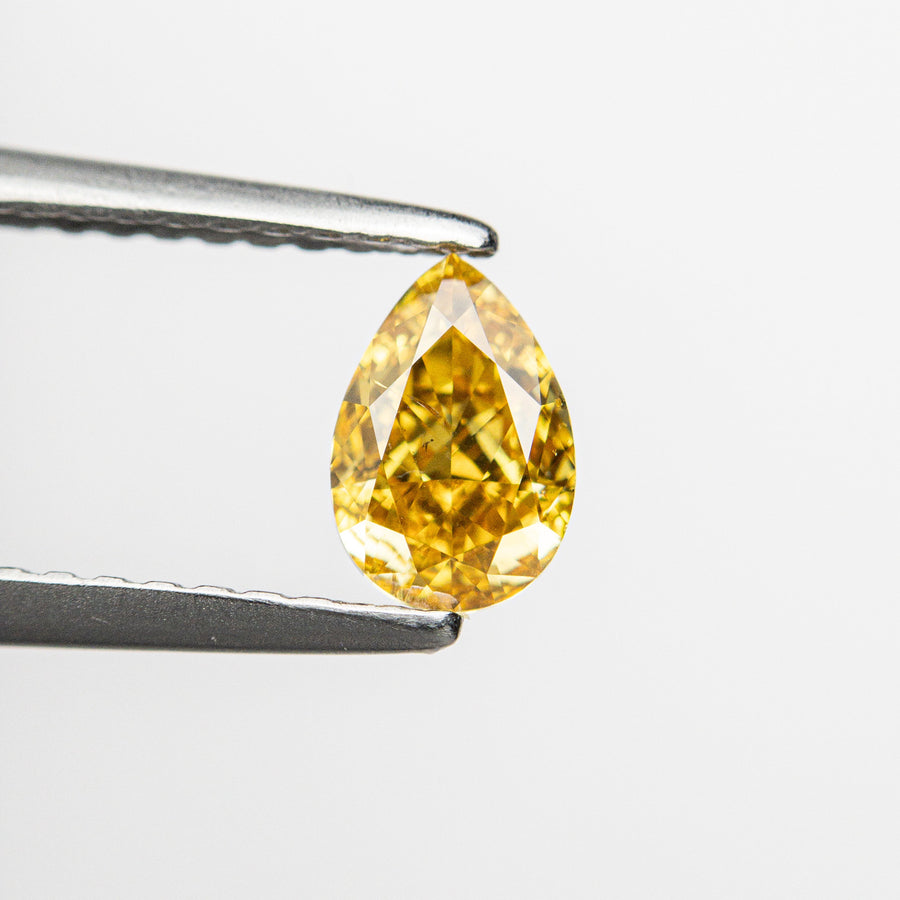 The 0.50ct 6.13x4.13x2.67mm SI2 Fancy Deep Yellowish Orange Pear Brilliant 24129-01 by East London jeweller Rachel Boston | Discover our collections of unique and timeless engagement rings, wedding rings, and modern fine jewellery. - Rachel Boston Jewellery