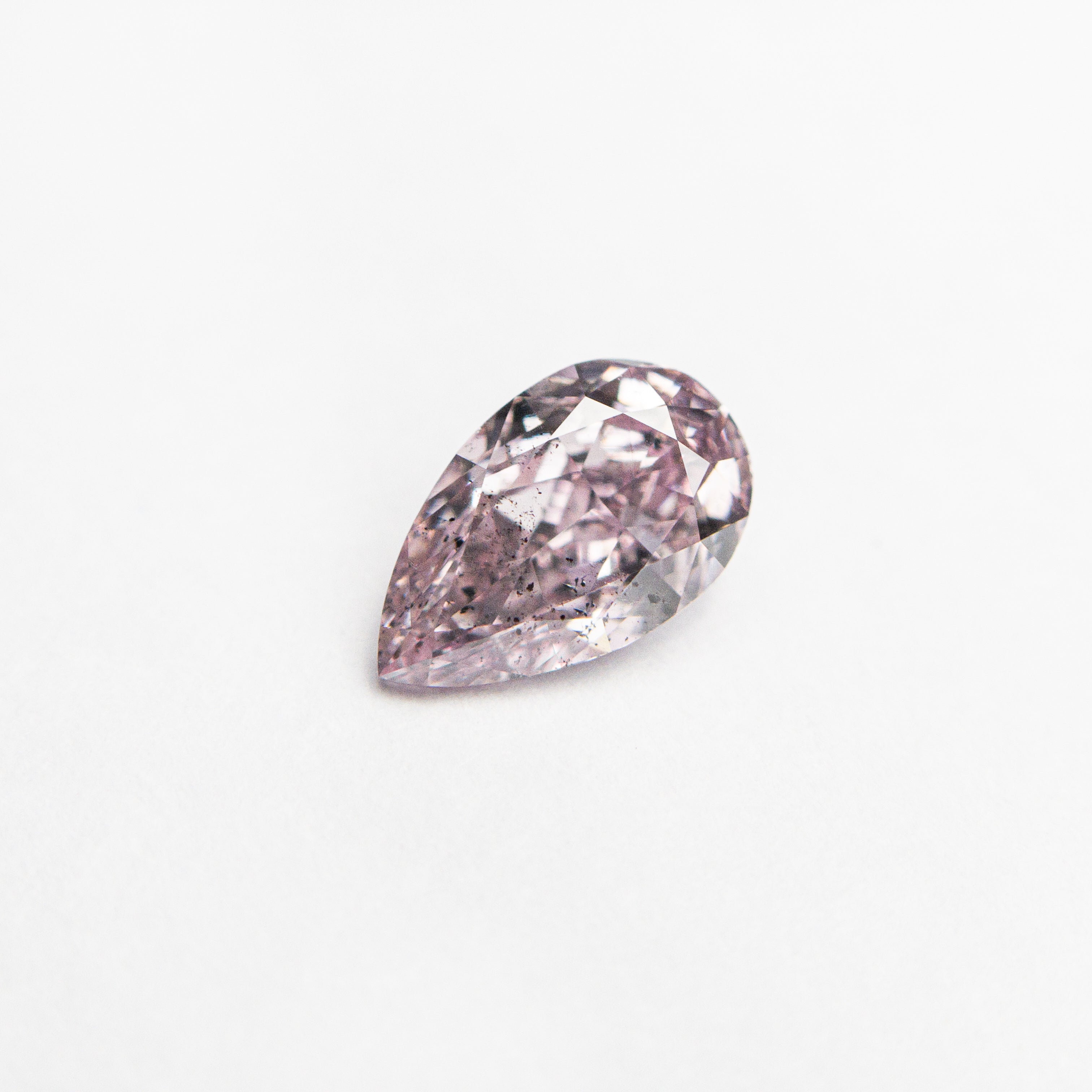 The 0.50ct 6.68x4.07x2.65mm GIA SI2 Fancy Purplish Pink Pear Brilliant 🇦🇺 24125-01 by East London jeweller Rachel Boston | Discover our collections of unique and timeless engagement rings, wedding rings, and modern fine jewellery.