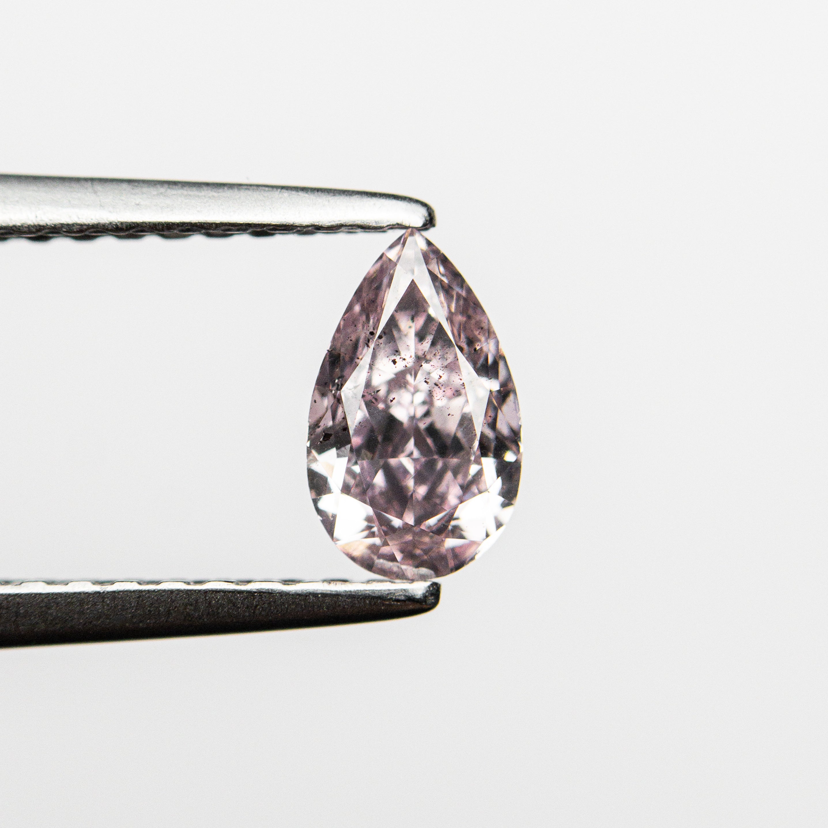 The 0.50ct 6.68x4.07x2.65mm GIA SI2 Fancy Purplish Pink Pear Brilliant 🇦🇺 24125-01 by East London jeweller Rachel Boston | Discover our collections of unique and timeless engagement rings, wedding rings, and modern fine jewellery.