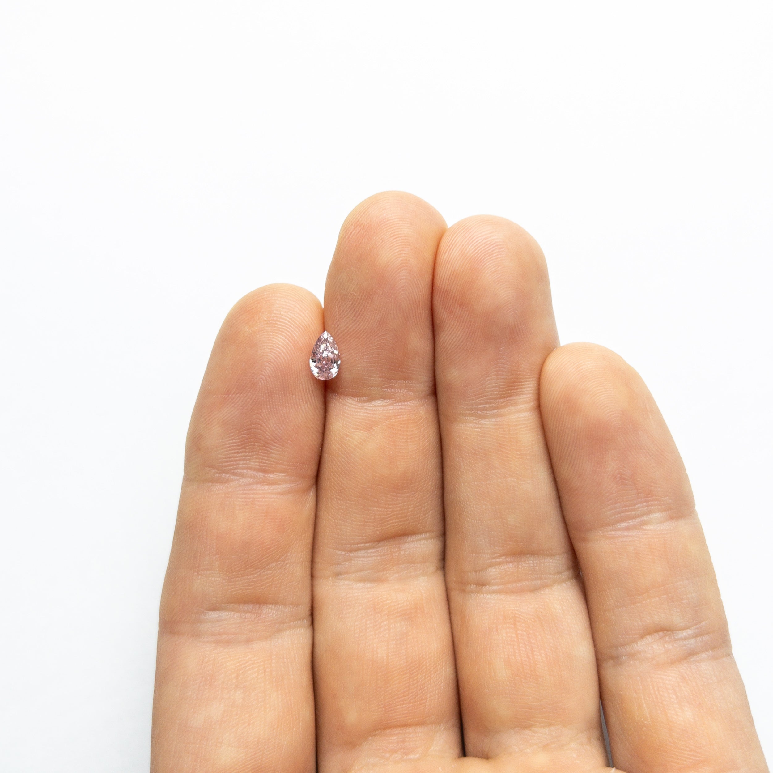 The 0.50ct 6.68x4.07x2.65mm GIA SI2 Fancy Purplish Pink Pear Brilliant 🇦🇺 24125-01 by East London jeweller Rachel Boston | Discover our collections of unique and timeless engagement rings, wedding rings, and modern fine jewellery.
