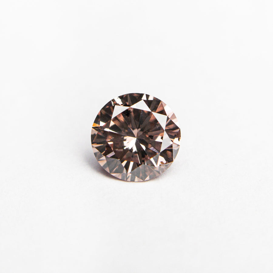 The 0.51ct 5.31x5.27x3.05mm GIA Fancy Deep Brownish Orangy Pink Round Brilliant 24146-01 by East London jeweller Rachel Boston | Discover our collections of unique and timeless engagement rings, wedding rings, and modern fine jewellery. - Rachel Boston Jewellery