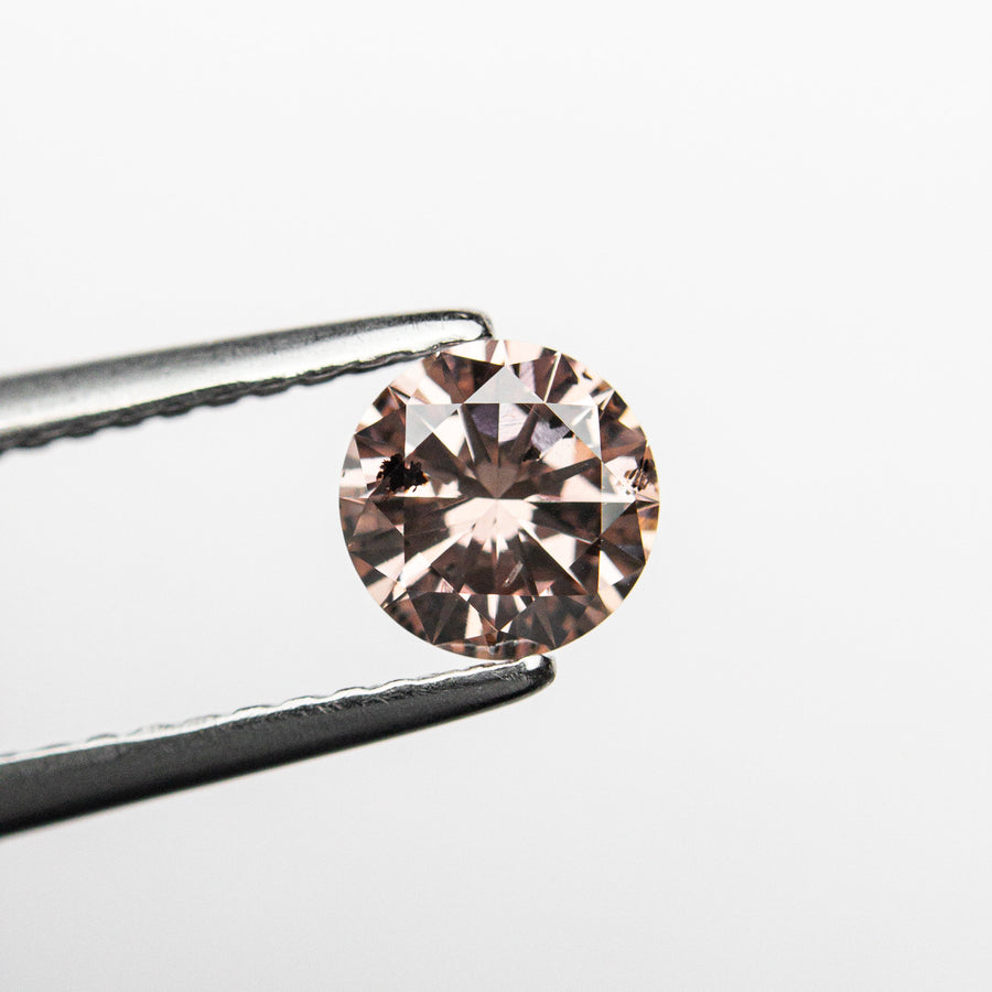 The 0.51ct 5.31x5.27x3.05mm GIA Fancy Deep Brownish Orangy Pink Round Brilliant 24146-01 by East London jeweller Rachel Boston | Discover our collections of unique and timeless engagement rings, wedding rings, and modern fine jewellery. - Rachel Boston Jewellery