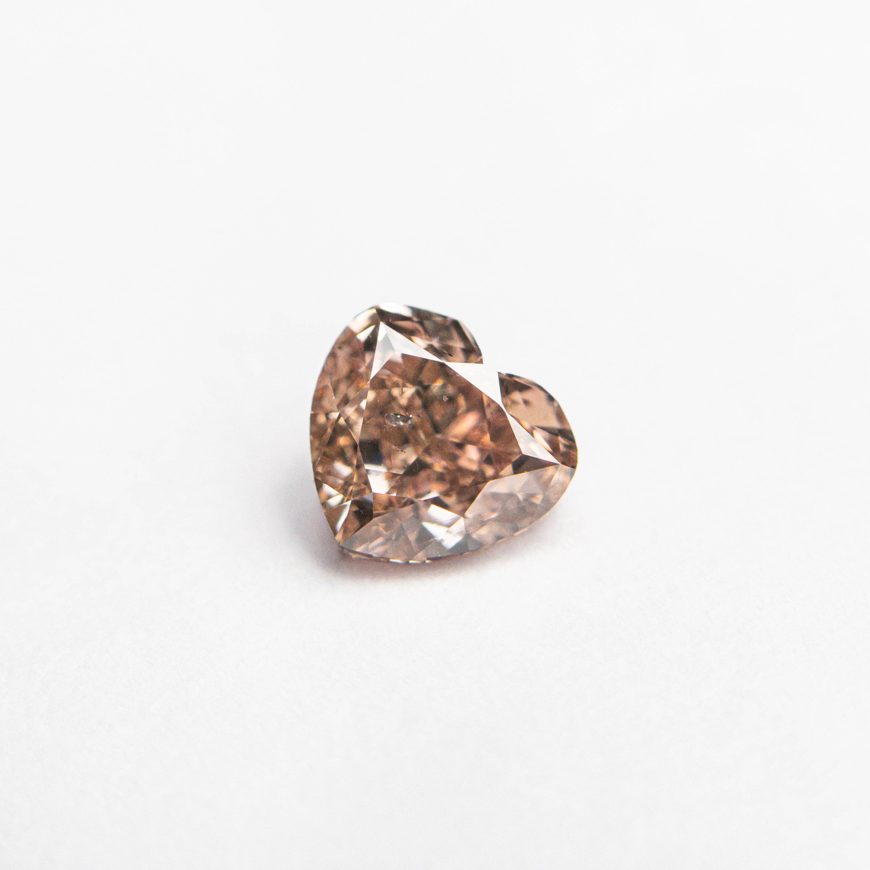 The 0.53ct 4.73x5.14x2.92mm GIA I1 Fancy Brown-Pink Heart Brilliant 🇦🇺 24115-01 by East London jeweller Rachel Boston | Discover our collections of unique and timeless engagement rings, wedding rings, and modern fine jewellery.