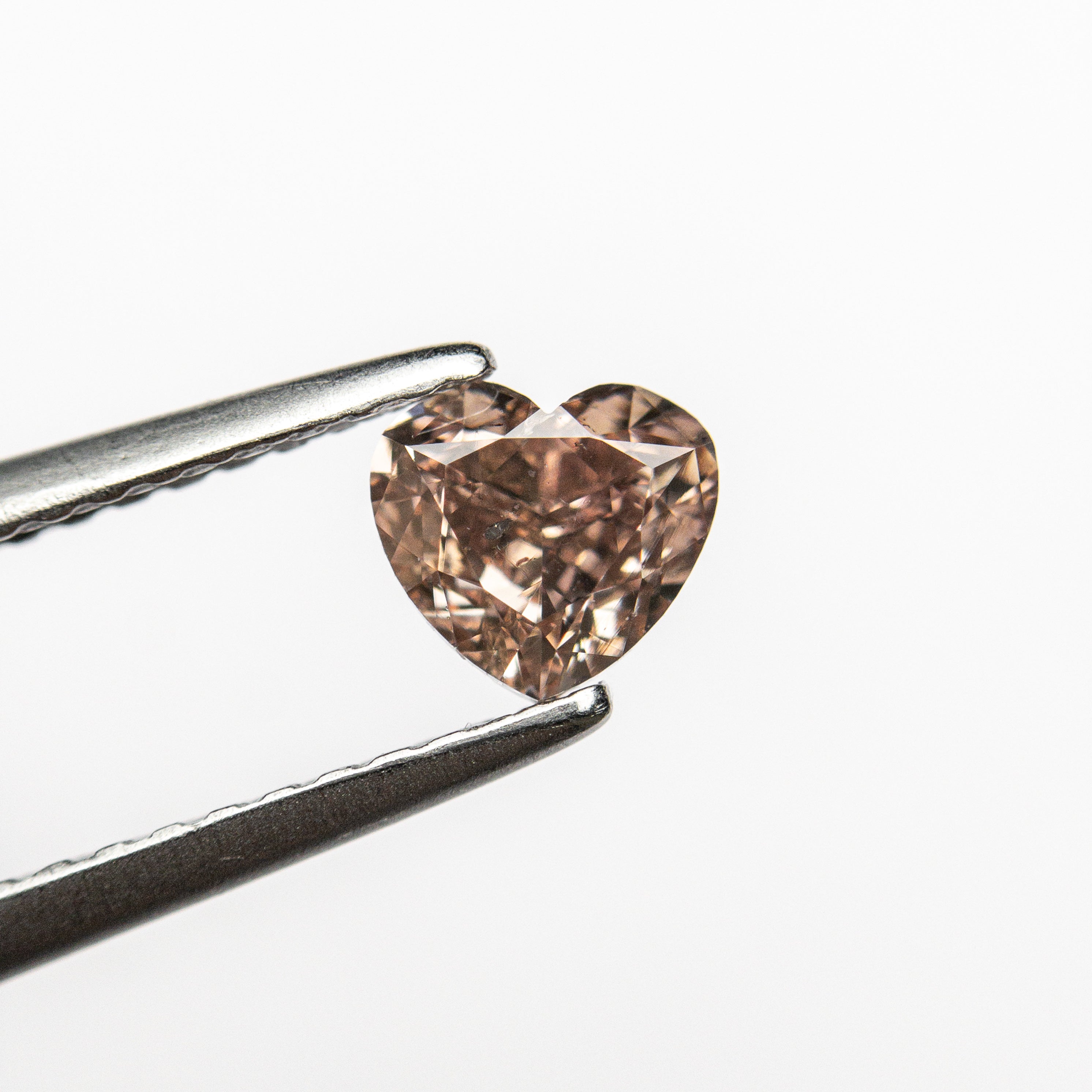 The 0.53ct 4.73x5.14x2.92mm GIA I1 Fancy Brown-Pink Heart Brilliant 🇦🇺 24115-01 by East London jeweller Rachel Boston | Discover our collections of unique and timeless engagement rings, wedding rings, and modern fine jewellery.