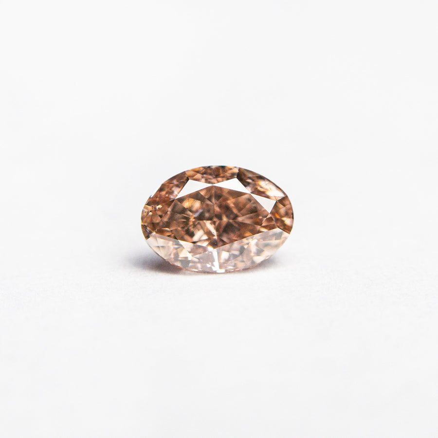 The 0.53ct 5.75x4.03x2.87mm GIA VS2 Fancy Brownish Orangy Pink Oval Brilliant 🇦🇺 24158-01 by East London jeweller Rachel Boston | Discover our collections of unique and timeless engagement rings, wedding rings, and modern fine jewellery. - Rachel Boston Jewellery