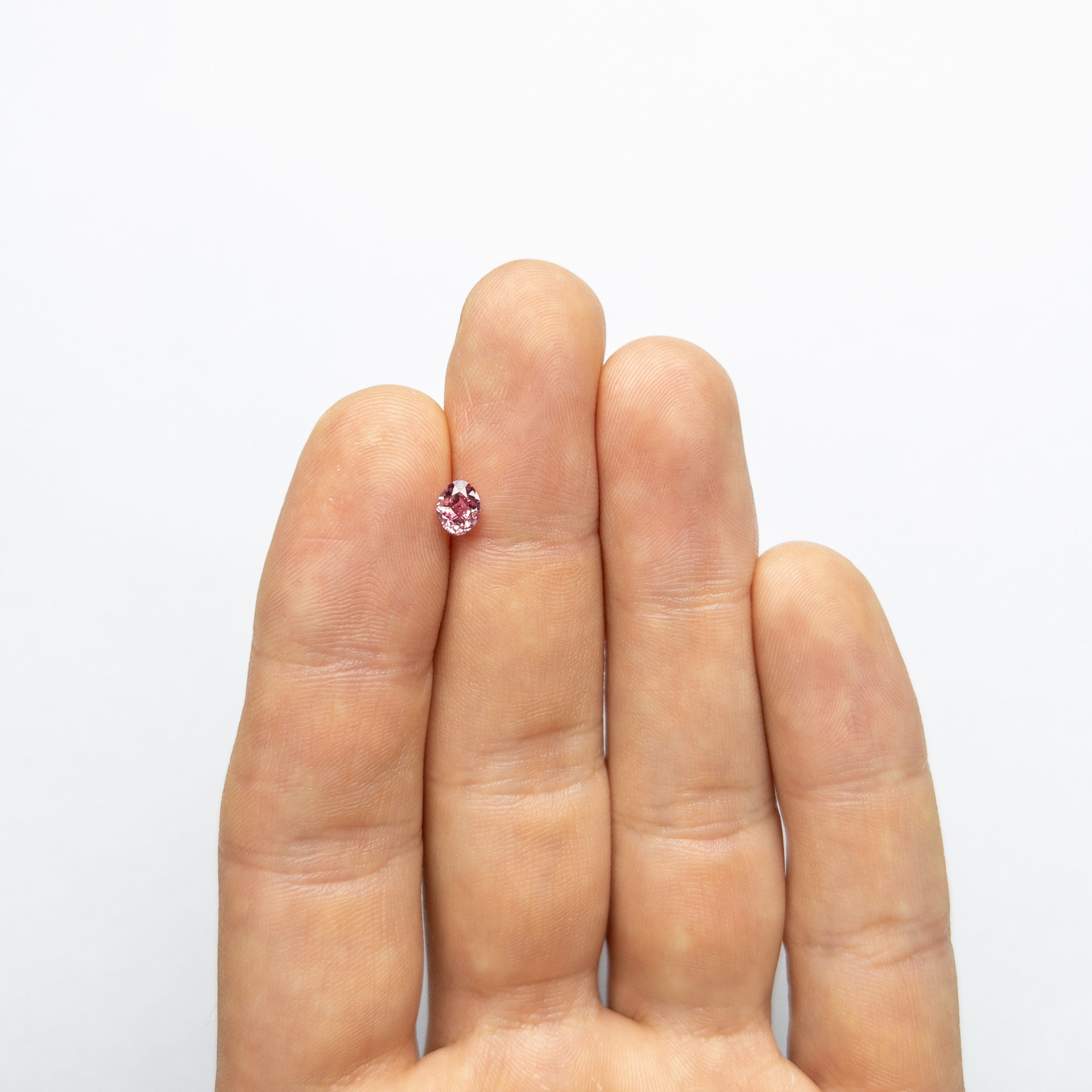 The 0.61ct 5.57x4.44x3.13mm GIA VS2 Fancy Vivid Purplish Pink Oval Brilliant 🇦🇺 24137-01 by East London jeweller Rachel Boston | Discover our collections of unique and timeless engagement rings, wedding rings, and modern fine jewellery.