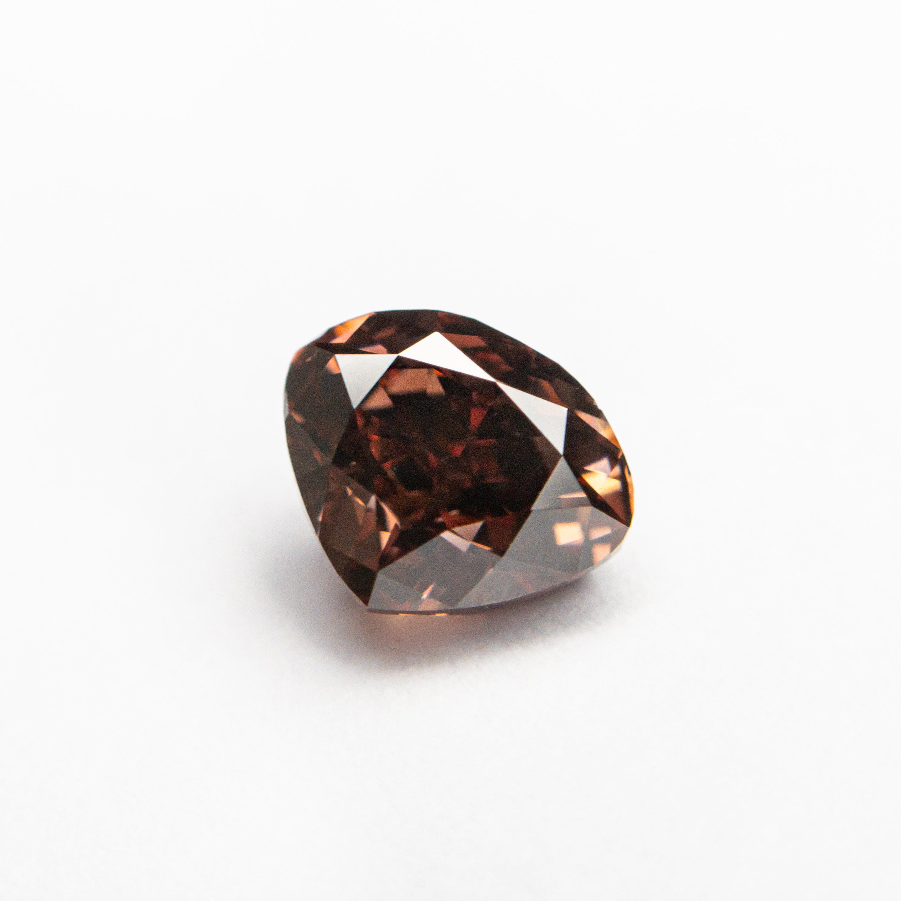The 1.00ct 5.37x6.56x3.93mm GIA VS2 Fancy Deep Pink-Brown Heart Brilliant 🇦🇺 24116-01 by East London jeweller Rachel Boston | Discover our collections of unique and timeless engagement rings, wedding rings, and modern fine jewellery.