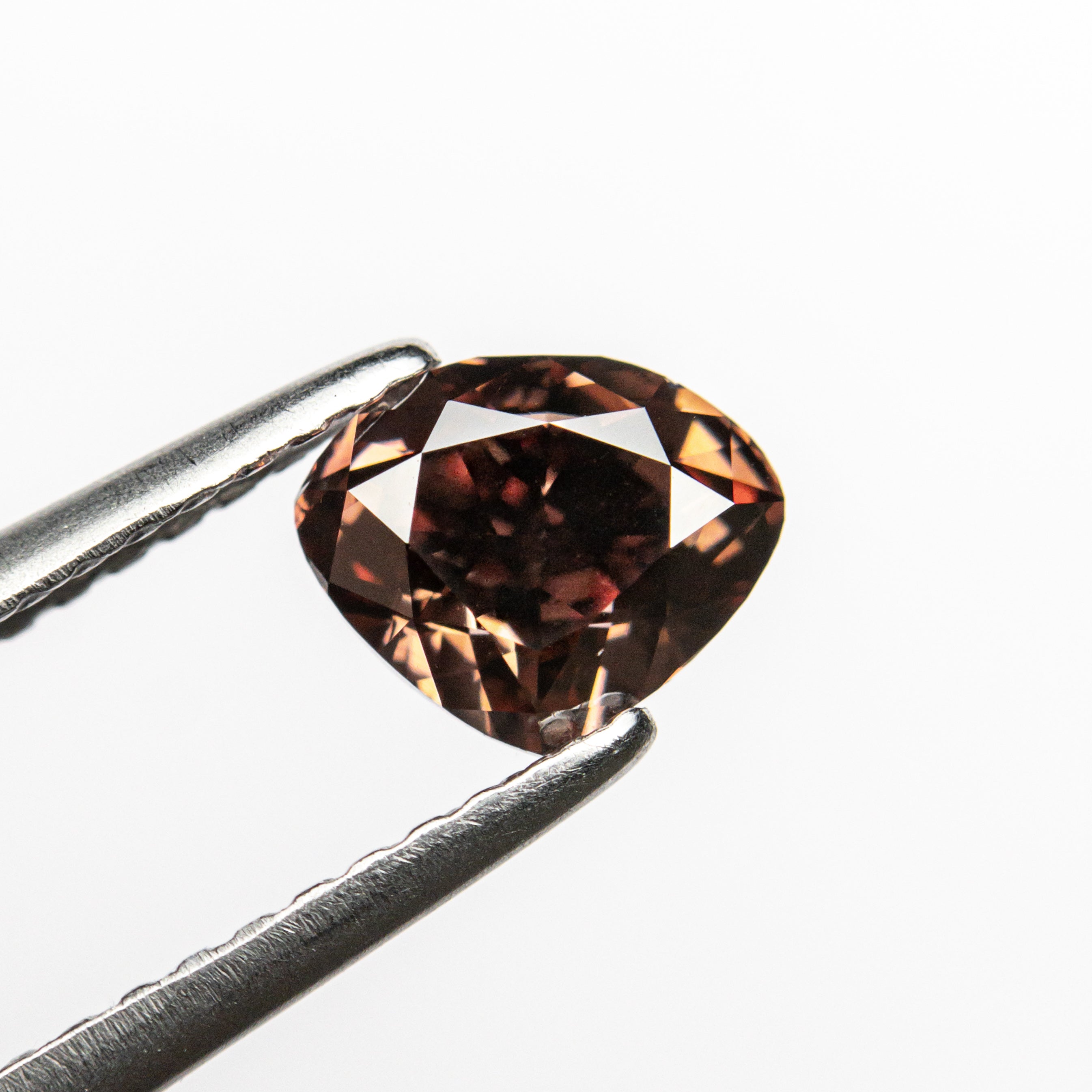 The 1.00ct 5.37x6.56x3.93mm GIA VS2 Fancy Deep Pink-Brown Heart Brilliant 🇦🇺 24116-01 by East London jeweller Rachel Boston | Discover our collections of unique and timeless engagement rings, wedding rings, and modern fine jewellery.