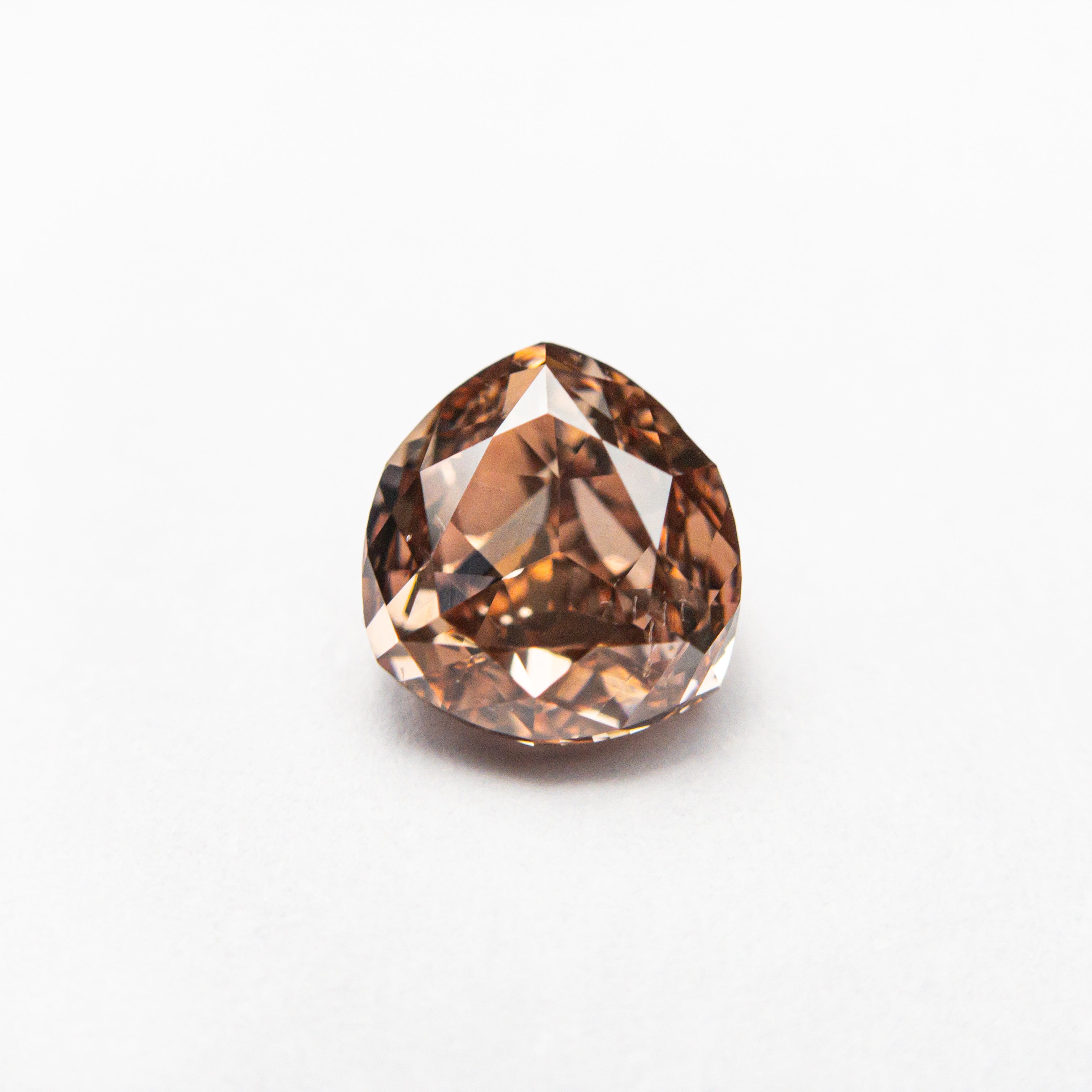 The 1.00ct 6.08x5.67x3.42mm GIA SI1 Fancy Deep Brown-Pink Trillion Brilliant 🇦🇺 24113-01 by East London jeweller Rachel Boston | Discover our collections of unique and timeless engagement rings, wedding rings, and modern fine jewellery.