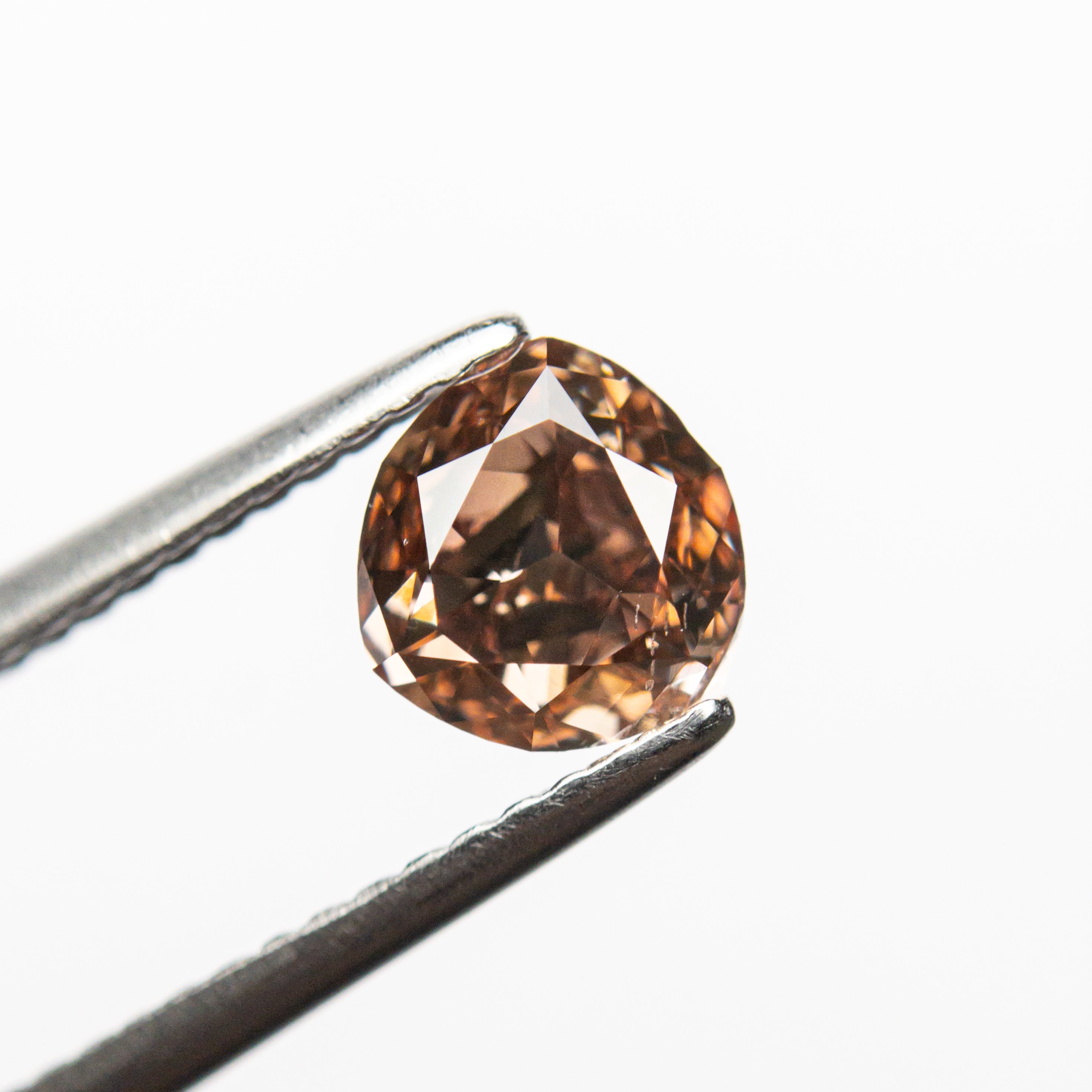 The 1.00ct 6.08x5.67x3.42mm GIA SI1 Fancy Deep Brown-Pink Trillion Brilliant 🇦🇺 24113-01 by East London jeweller Rachel Boston | Discover our collections of unique and timeless engagement rings, wedding rings, and modern fine jewellery.