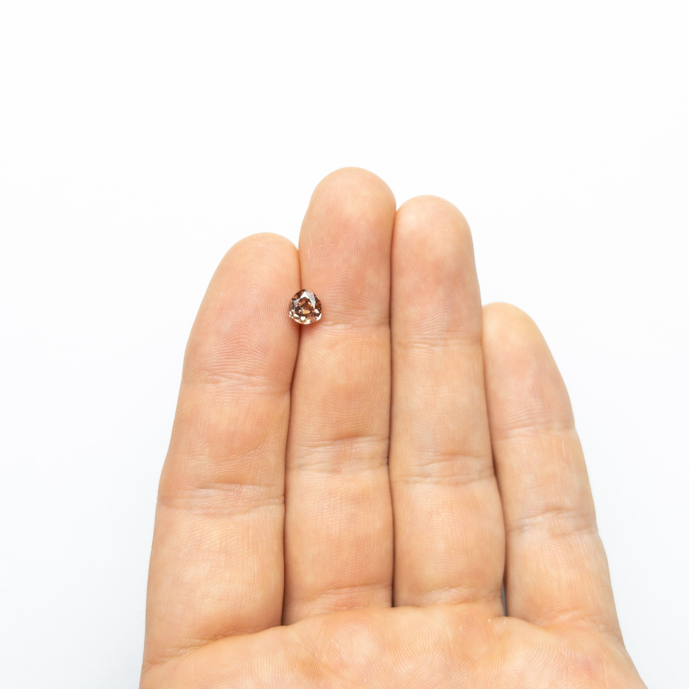 The 1.00ct 6.08x5.67x3.42mm GIA SI1 Fancy Deep Brown-Pink Trillion Brilliant 🇦🇺 24113-01 by East London jeweller Rachel Boston | Discover our collections of unique and timeless engagement rings, wedding rings, and modern fine jewellery.