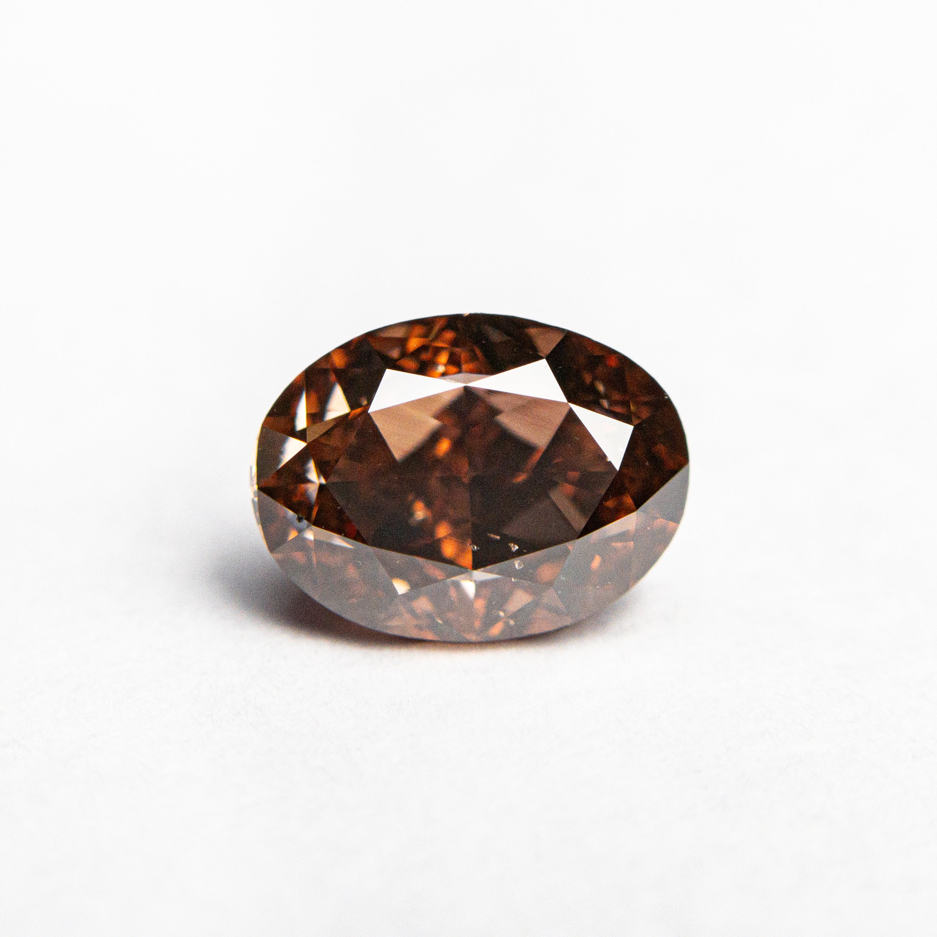 The 1.50ct 7.69x5.74x4.16mm GIA SI1 Fancy Deep Brown-Pink Oval Brilliant 🇦🇺 24161-01 by East London jeweller Rachel Boston | Discover our collections of unique and timeless engagement rings, wedding rings, and modern fine jewellery.