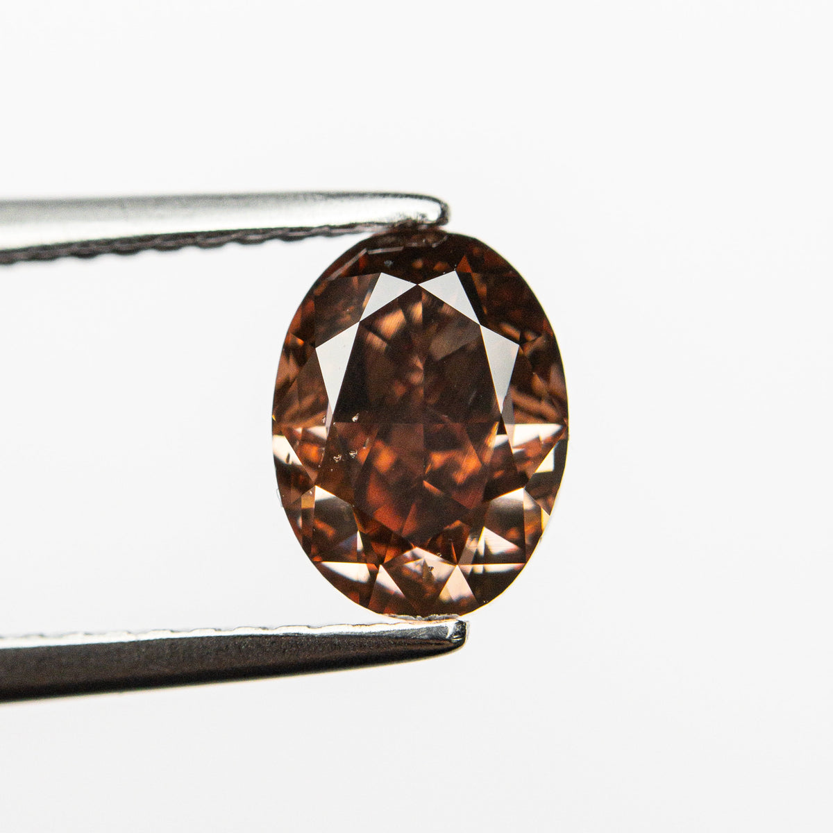 The 1.50ct 7.69x5.74x4.16mm GIA SI1 Fancy Deep Brown-Pink Oval Brilliant 🇦🇺 24161-01 by East London jeweller Rachel Boston | Discover our collections of unique and timeless engagement rings, wedding rings, and modern fine jewellery.