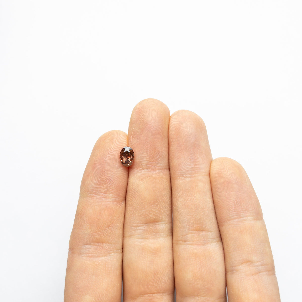 The 1.50ct 7.69x5.74x4.16mm GIA SI1 Fancy Deep Brown-Pink Oval Brilliant 🇦🇺 24161-01 by East London jeweller Rachel Boston | Discover our collections of unique and timeless engagement rings, wedding rings, and modern fine jewellery.
