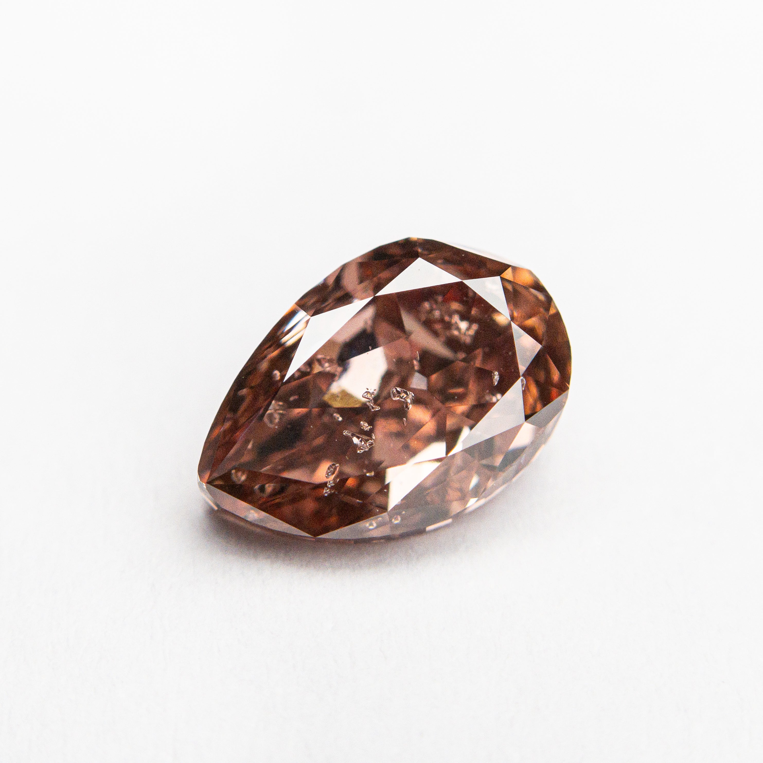 The 1.50ct 8.44x5.77x3.82mm GIA Fancy Deep Orangy Pink Pear Brilliant 🇦🇺 24152-01 by East London jeweller Rachel Boston | Discover our collections of unique and timeless engagement rings, wedding rings, and modern fine jewellery.
