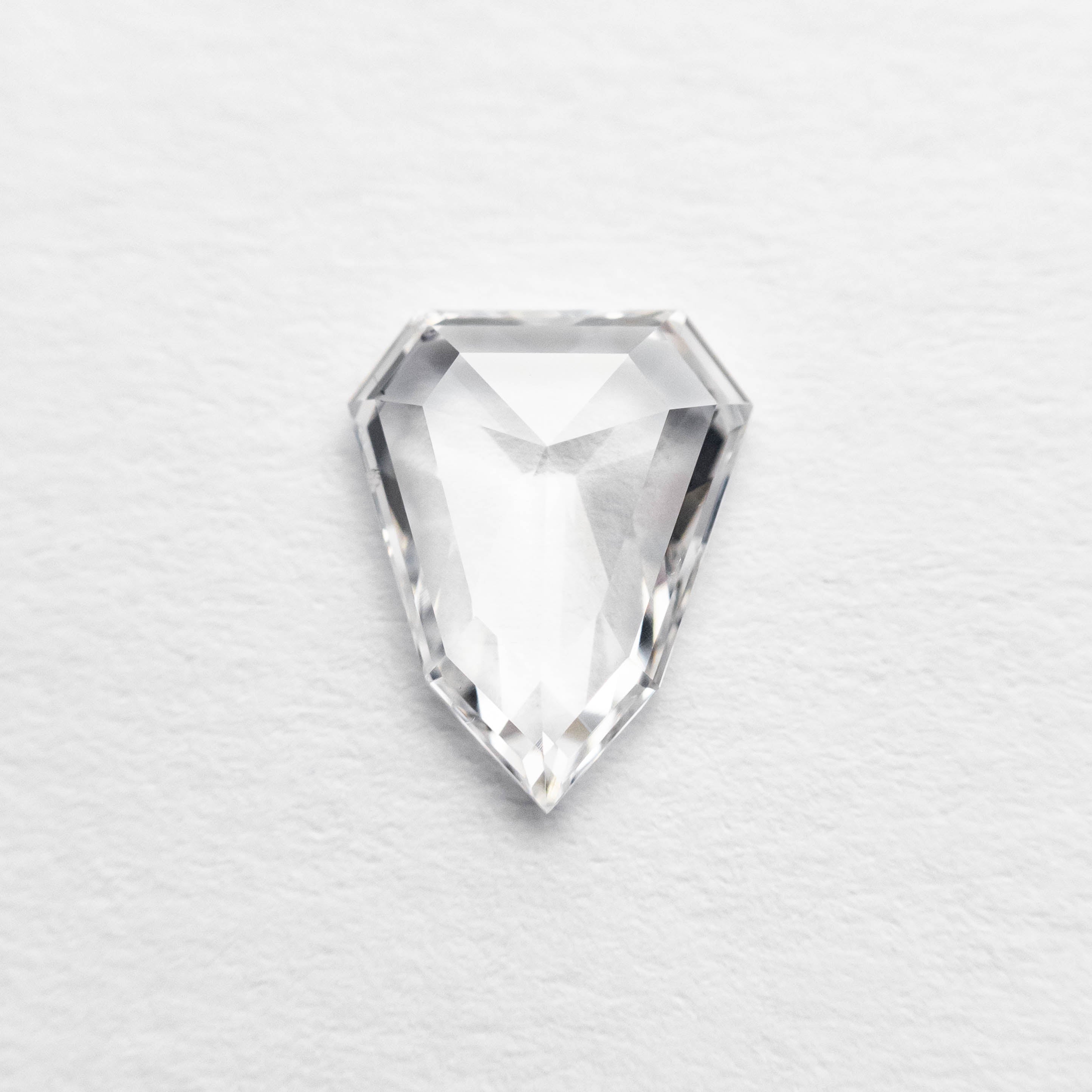 The 0.60ct 7.36x5.90x1.76mm Shield Rosecut 18496-03 by East London jeweller Rachel Boston | Discover our collections of unique and timeless engagement rings, wedding rings, and modern fine jewellery.