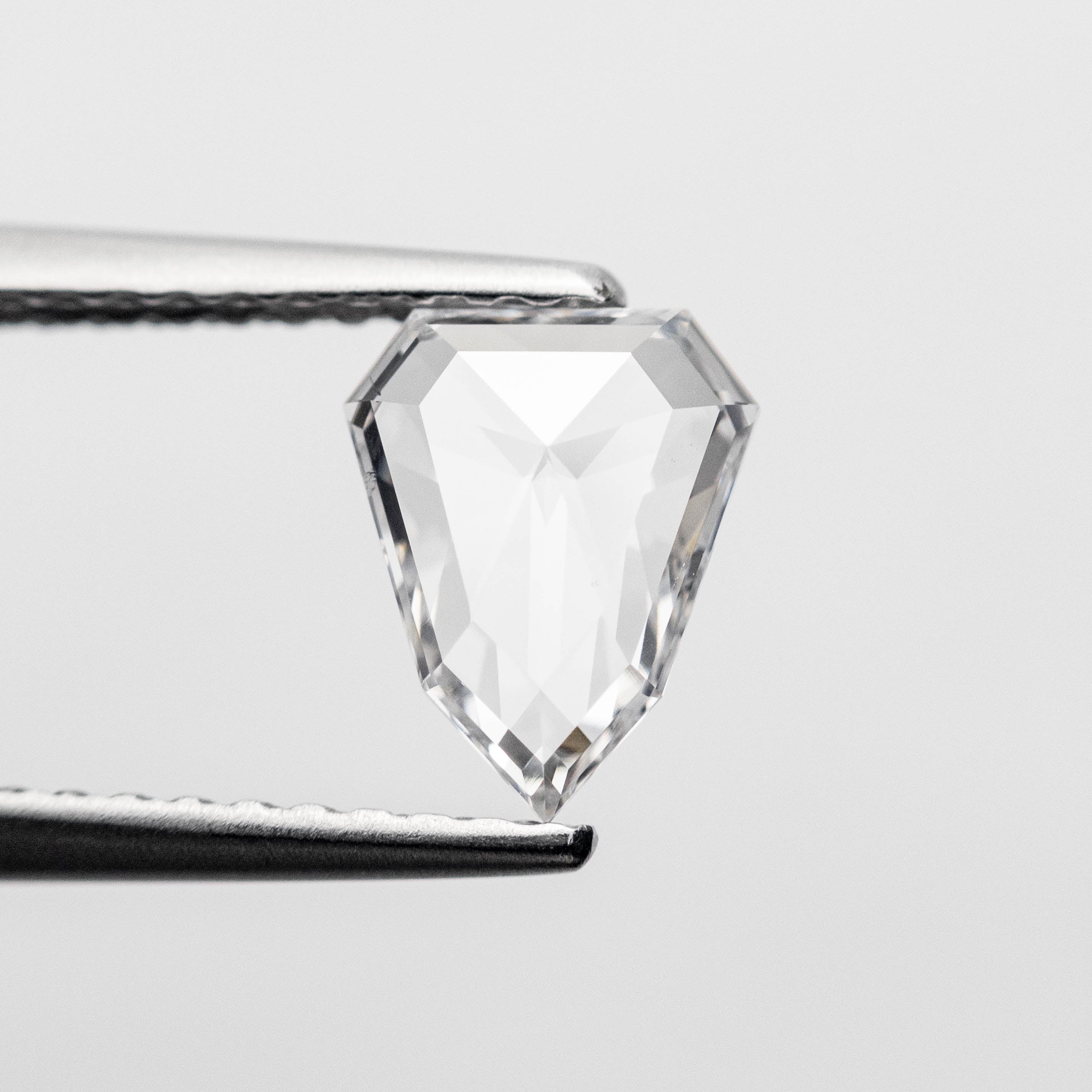 The 0.60ct 7.36x5.90x1.76mm Shield Rosecut 18496-03 by East London jeweller Rachel Boston | Discover our collections of unique and timeless engagement rings, wedding rings, and modern fine jewellery.