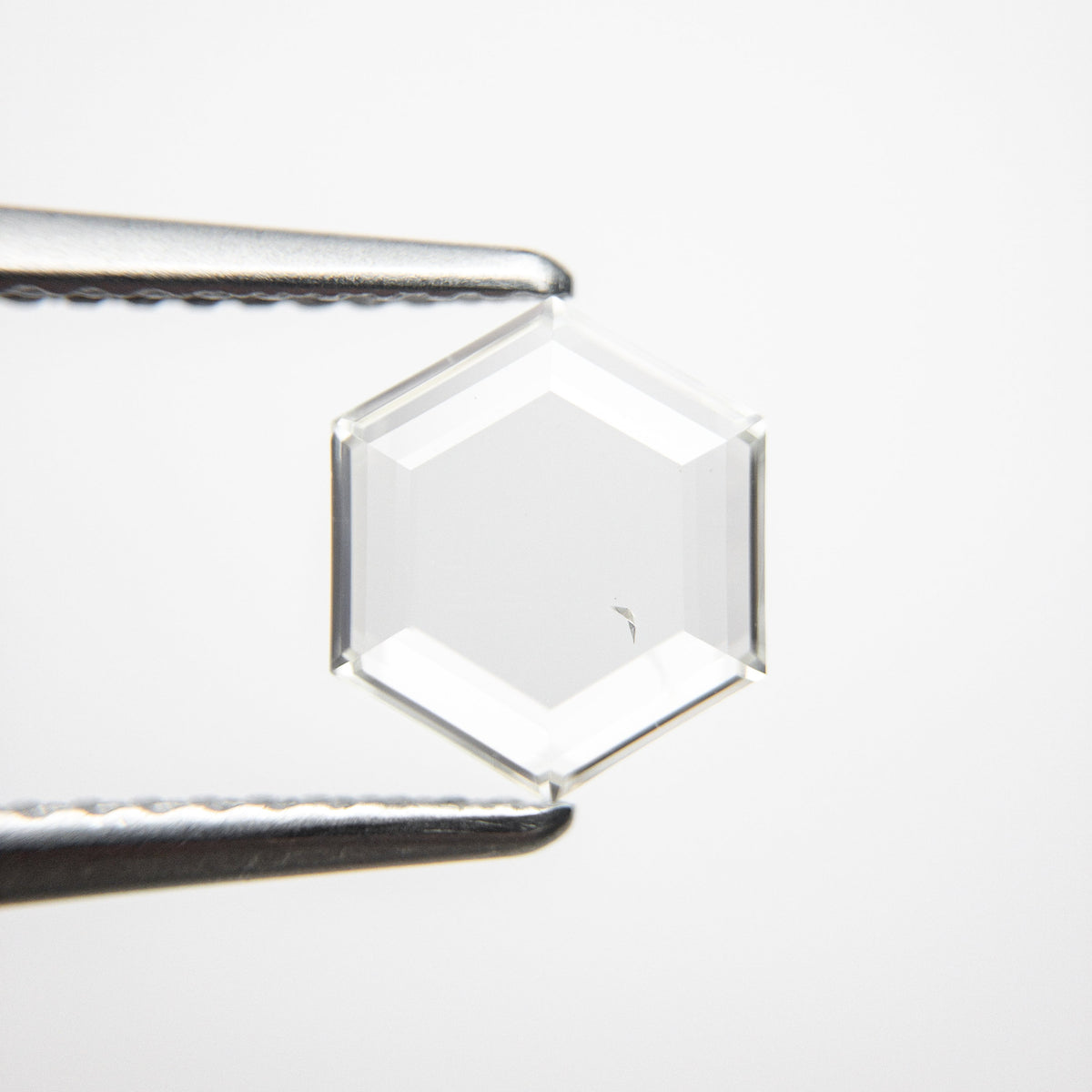 The 1.03ct 8.01x7.00x1.78mm SI1 J-K Hexagon Portrait Cut 18878-04 by East London jeweller Rachel Boston | Discover our collections of unique and timeless engagement rings, wedding rings, and modern fine jewellery.