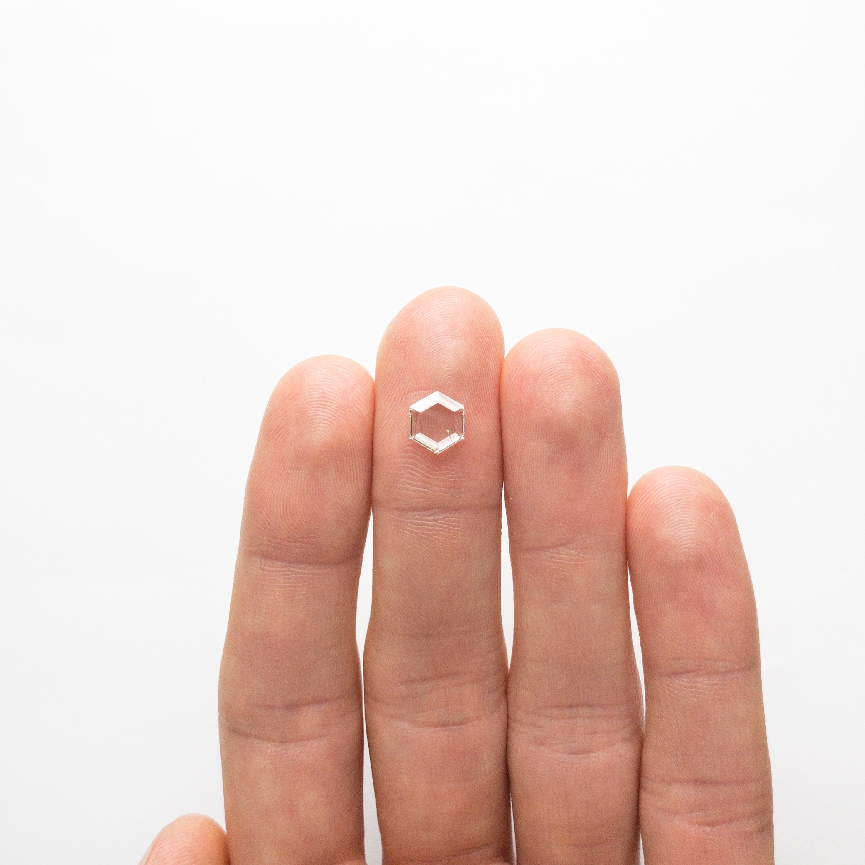 The 1.03ct 8.01x7.00x1.78mm SI1 J-K Hexagon Portrait Cut 18878-04 by East London jeweller Rachel Boston | Discover our collections of unique and timeless engagement rings, wedding rings, and modern fine jewellery.