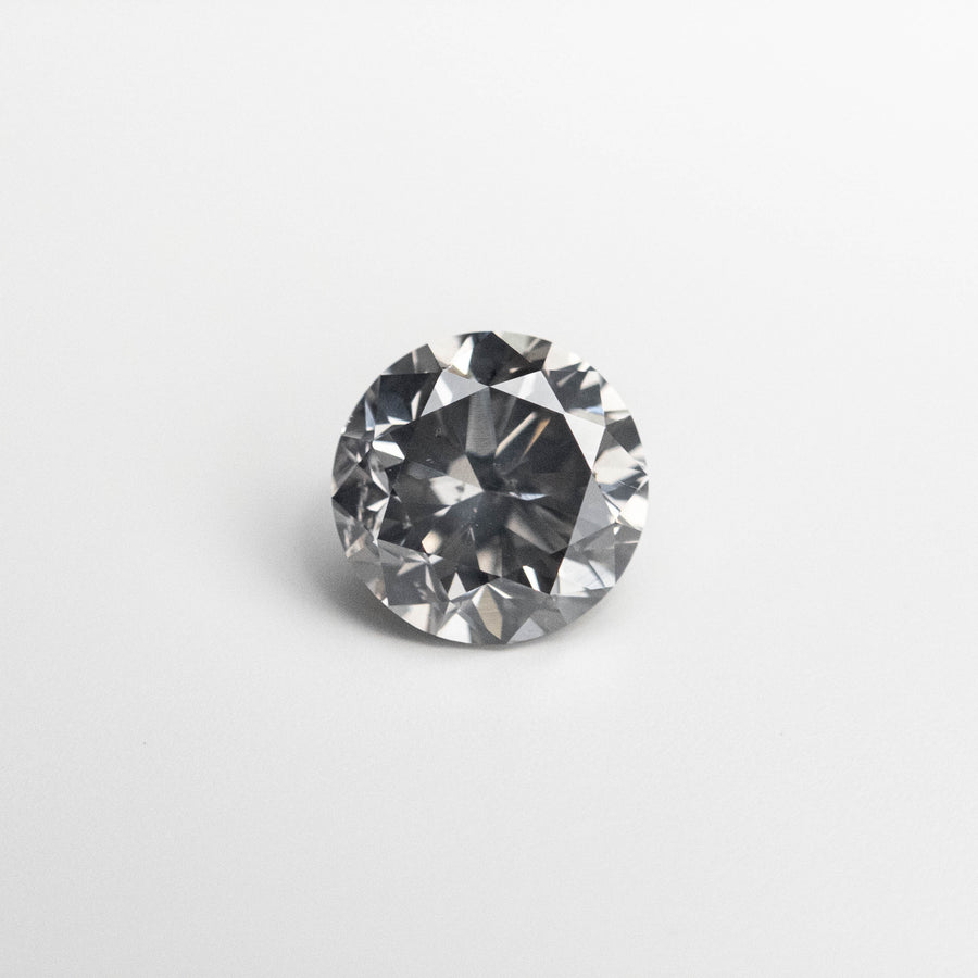 The 0.66ct 5.34-5.38x3.52mm Fancy Grey Round Brilliant 18968-10 by East London jeweller Rachel Boston | Discover our collections of unique and timeless engagement rings, wedding rings, and modern fine jewellery. - Rachel Boston Jewellery