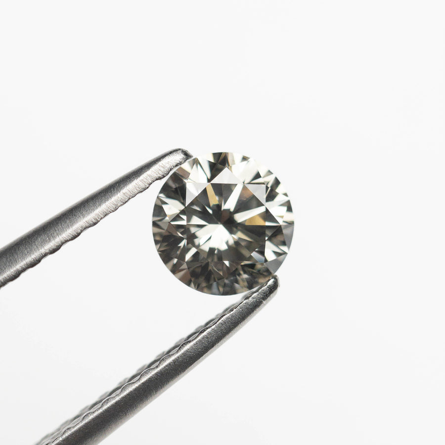 The 0.56ct 5.21x5.21x3.27mm Fancy Grey Round Brilliant 18968-23 by East London jeweller Rachel Boston | Discover our collections of unique and timeless engagement rings, wedding rings, and modern fine jewellery. - Rachel Boston Jewellery