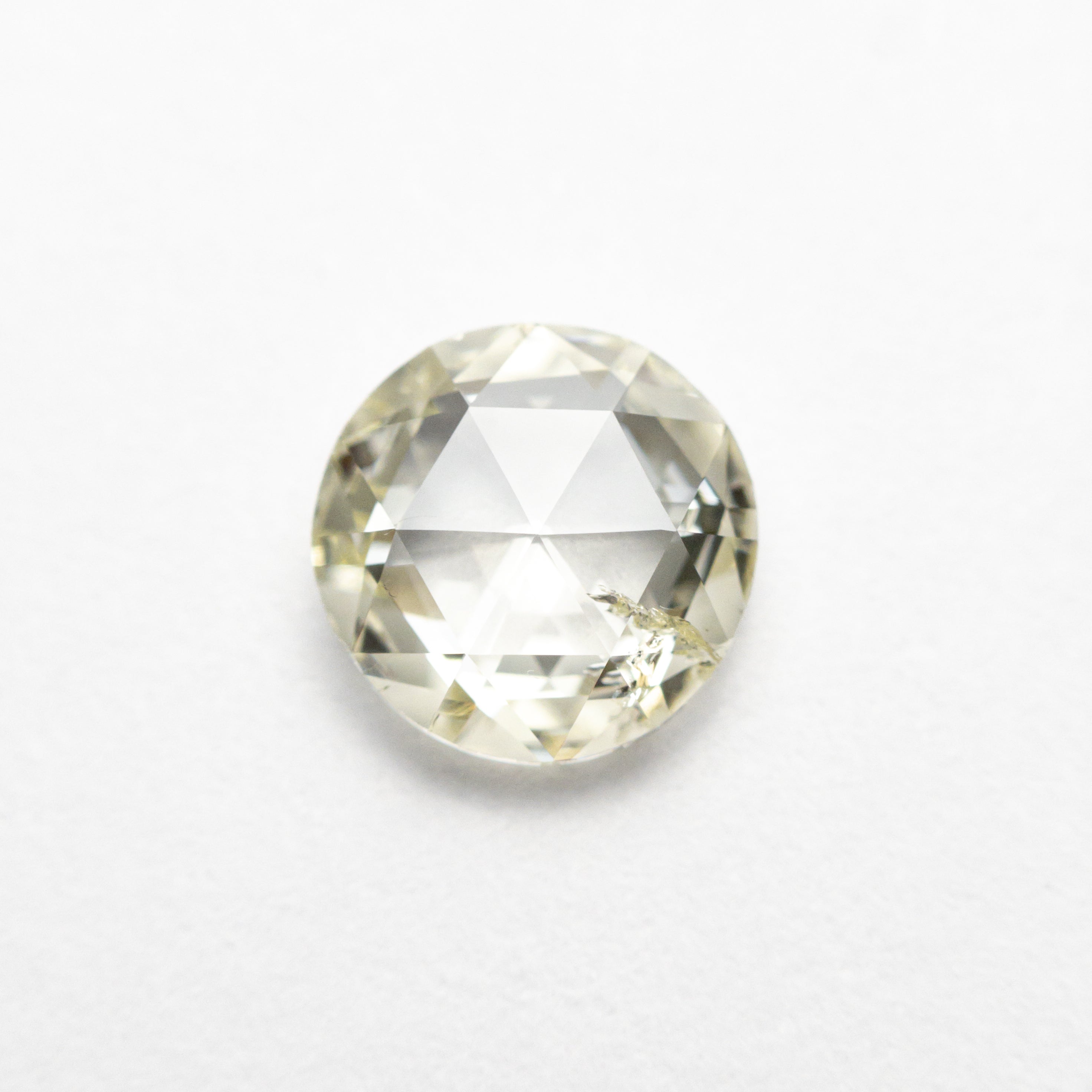 The 0.88ct 6.58x6.52x2.39mm I1 Q-R Round Double Cut 19017-08 by East London jeweller Rachel Boston | Discover our collections of unique and timeless engagement rings, wedding rings, and modern fine jewellery.