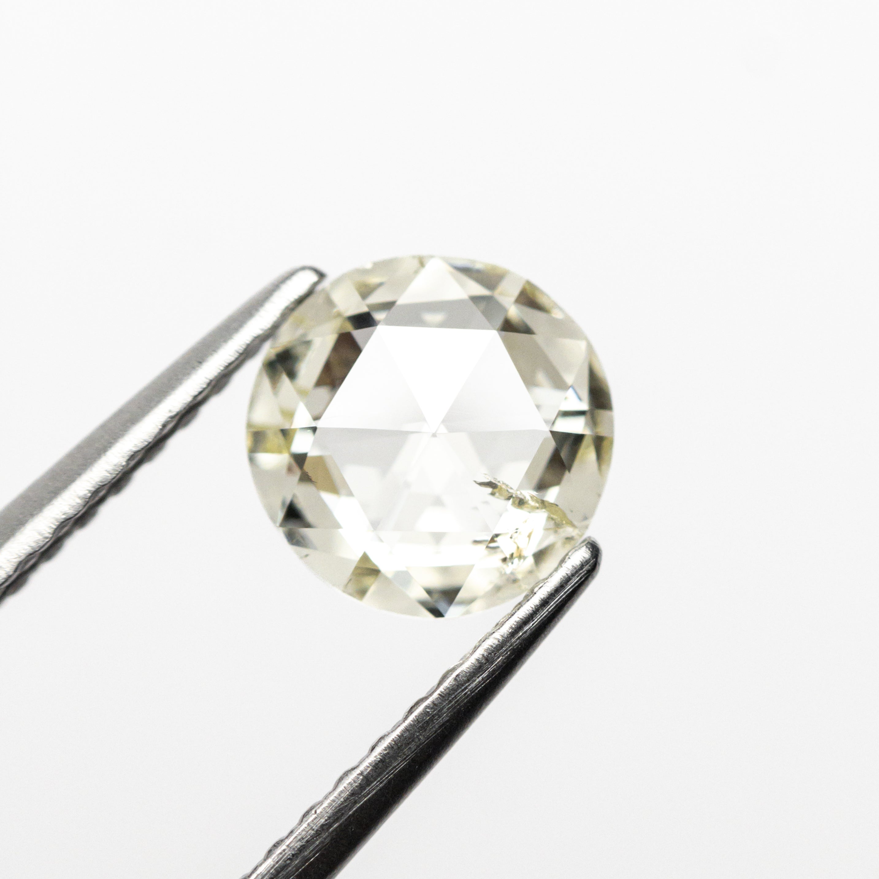The 0.88ct 6.58x6.52x2.39mm I1 Q-R Round Double Cut 19017-08 by East London jeweller Rachel Boston | Discover our collections of unique and timeless engagement rings, wedding rings, and modern fine jewellery.