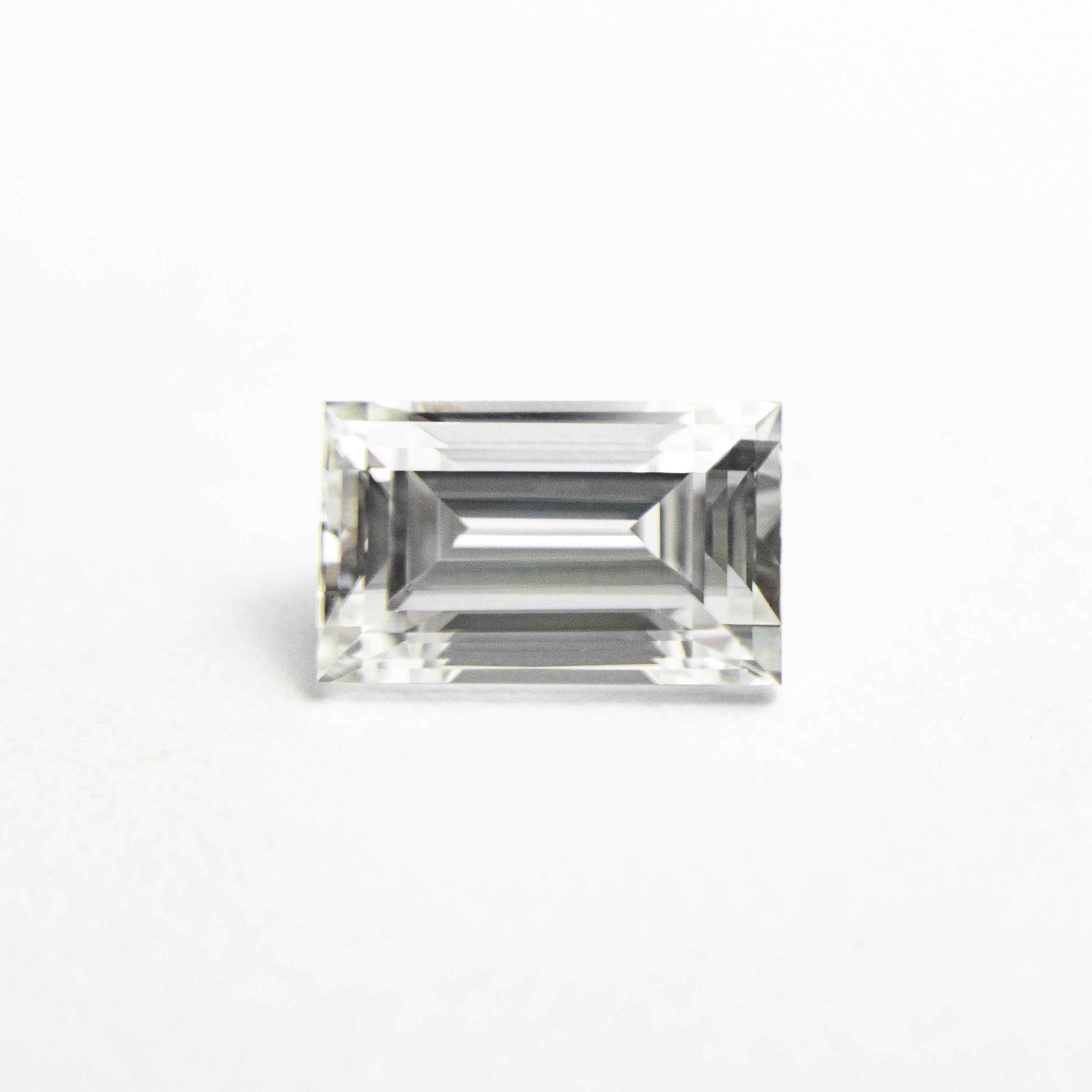The 1.01ct 6.98x4.31x3.41mm VS1 I Baguette Step Cut 19136-04 by East London jeweller Rachel Boston | Discover our collections of unique and timeless engagement rings, wedding rings, and modern fine jewellery.
