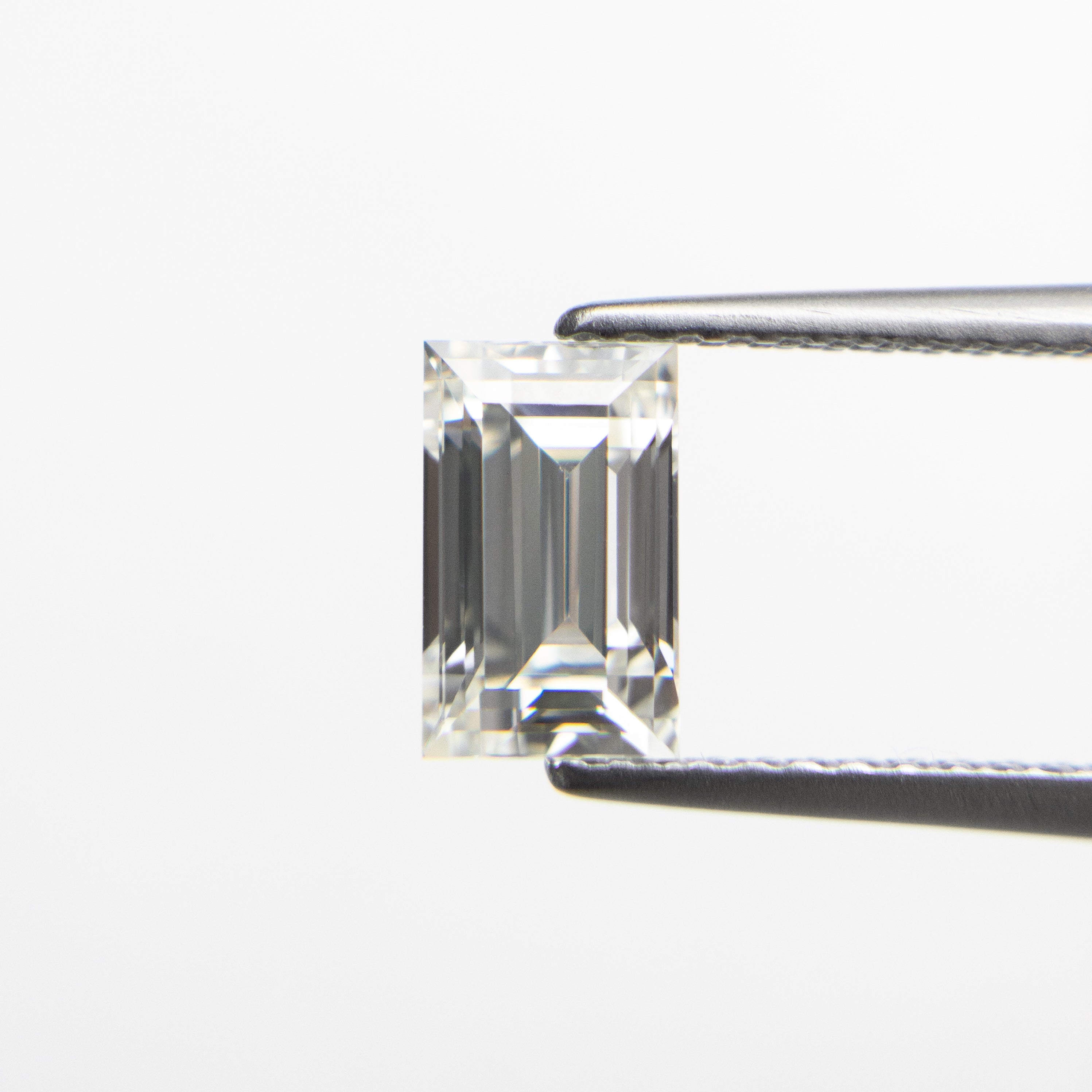 The 1.01ct 6.98x4.31x3.41mm VS1 I Baguette Step Cut 19136-04 by East London jeweller Rachel Boston | Discover our collections of unique and timeless engagement rings, wedding rings, and modern fine jewellery.