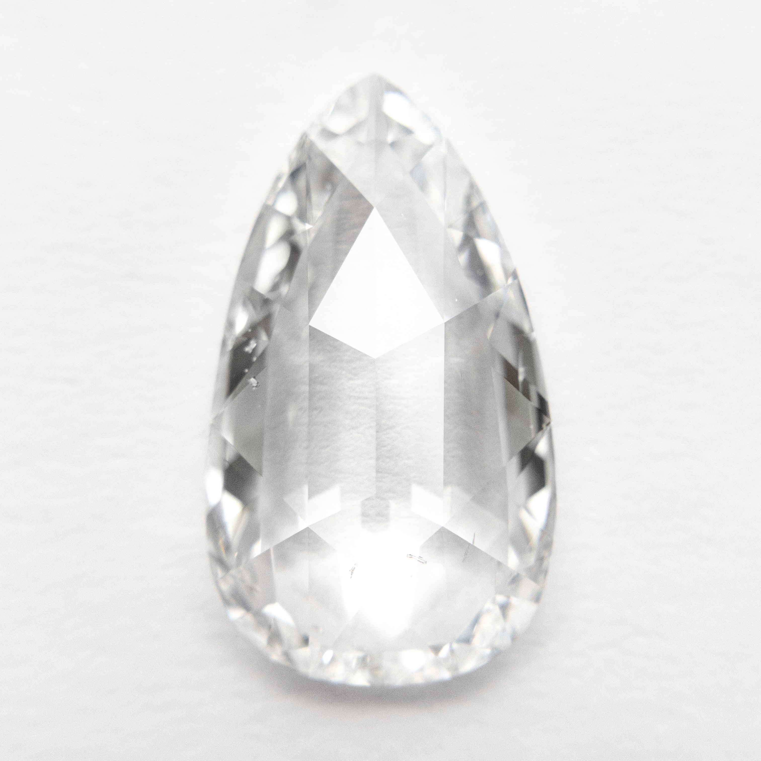 The 3.33ct 15.13x8.69x3.22mm GIA SI1 E Pear Rosecut 19157-01 by East London jeweller Rachel Boston | Discover our collections of unique and timeless engagement rings, wedding rings, and modern fine jewellery.