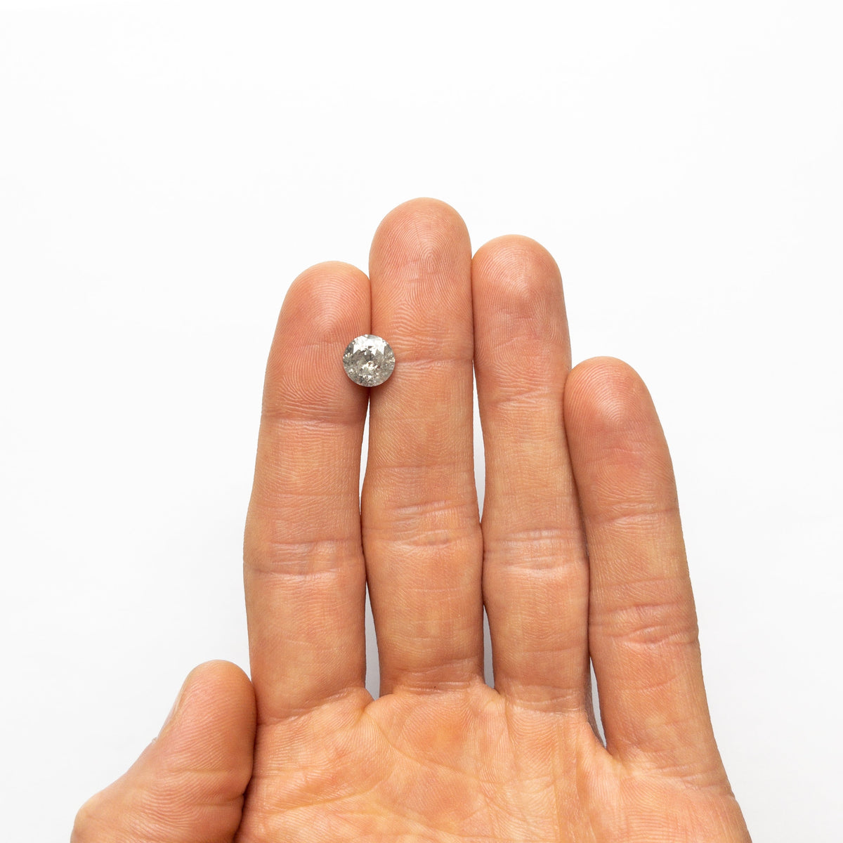 The 2.13ct 8.29x8.24x4.95mm Round Brilliant 19195-01 by East London jeweller Rachel Boston | Discover our collections of unique and timeless engagement rings, wedding rings, and modern fine jewellery.