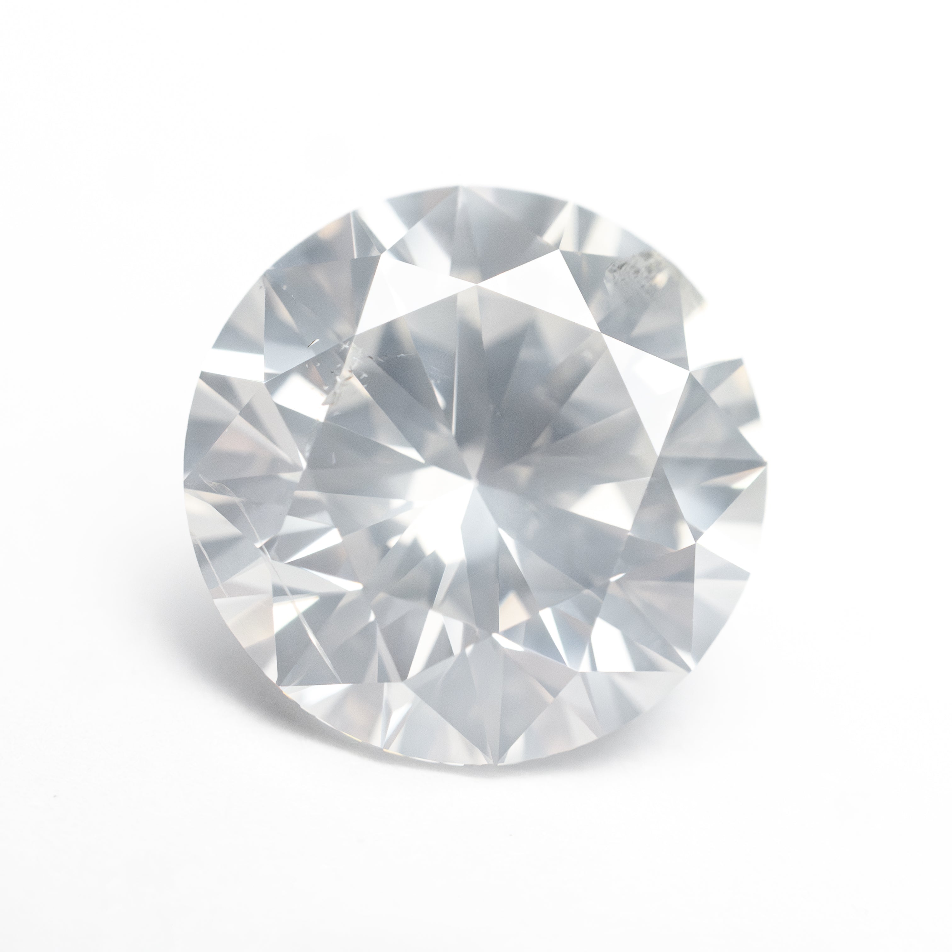 The 4.00ct 10.13x10.12x6.25mm GIA I2 Fancy White Round Brilliant 19263-01 by East London jeweller Rachel Boston | Discover our collections of unique and timeless engagement rings, wedding rings, and modern fine jewellery.