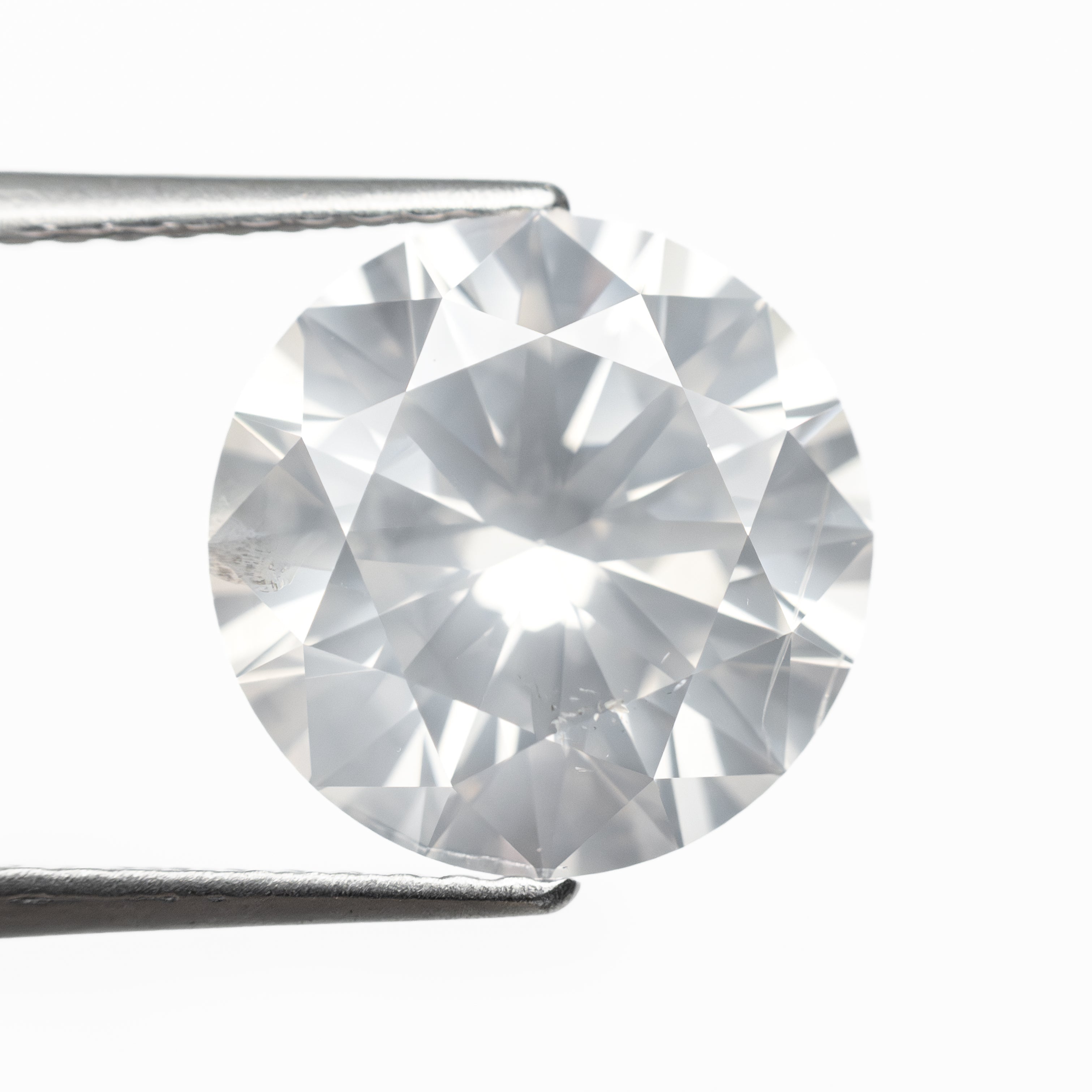 The 4.00ct 10.13x10.12x6.25mm GIA I2 Fancy White Round Brilliant 19263-01 by East London jeweller Rachel Boston | Discover our collections of unique and timeless engagement rings, wedding rings, and modern fine jewellery.
