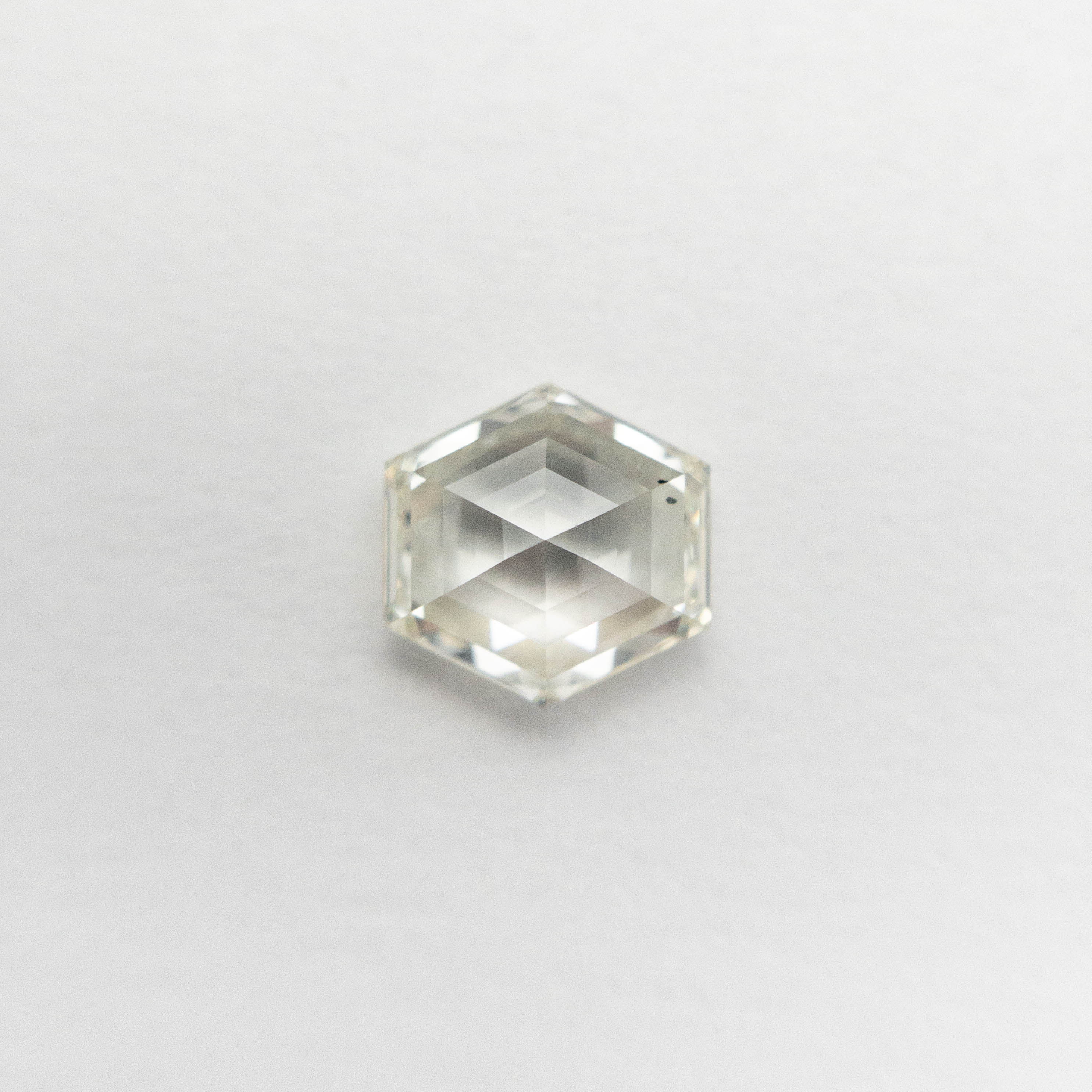 The 0.66ct 5.54x5.51x2.75mm SI1 K Hexagon Step Cut 🇨🇦 19386-09 by East London jeweller Rachel Boston | Discover our collections of unique and timeless engagement rings, wedding rings, and modern fine jewellery.