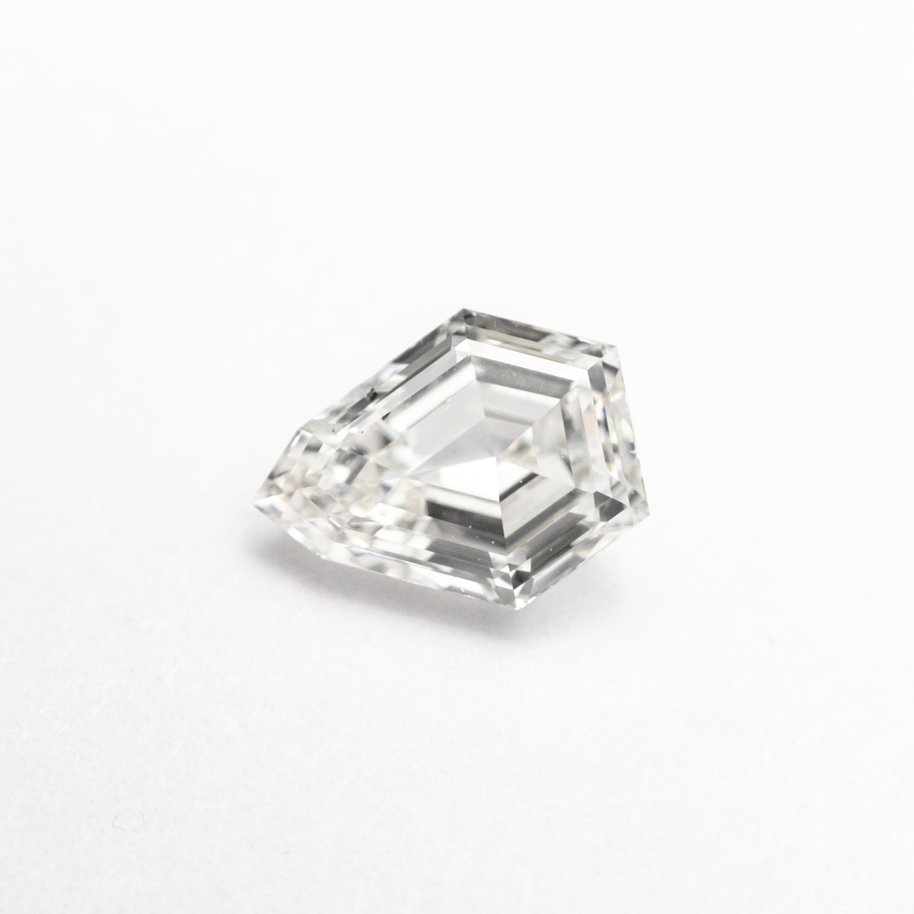 The 0.70ct 6.85x5.38x2.80mm SI1 G Shield Step Cut 19438-18 by East London jeweller Rachel Boston | Discover our collections of unique and timeless engagement rings, wedding rings, and modern fine jewellery.