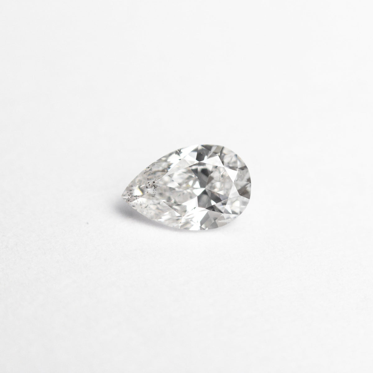 The 0.30ct 5.58x3.66x2.33mm SI2 E Pear Brilliant 19438-24 by East London jeweller Rachel Boston | Discover our collections of unique and timeless engagement rings, wedding rings, and modern fine jewellery.