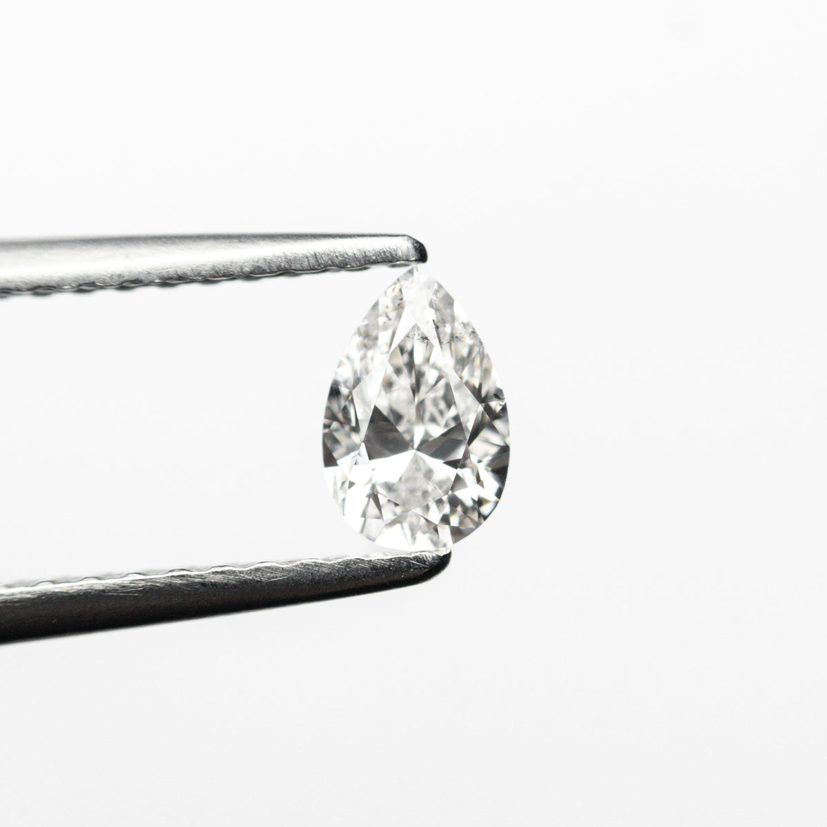 The 0.30ct 5.58x3.66x2.33mm SI2 E Pear Brilliant 19438-24 by East London jeweller Rachel Boston | Discover our collections of unique and timeless engagement rings, wedding rings, and modern fine jewellery.