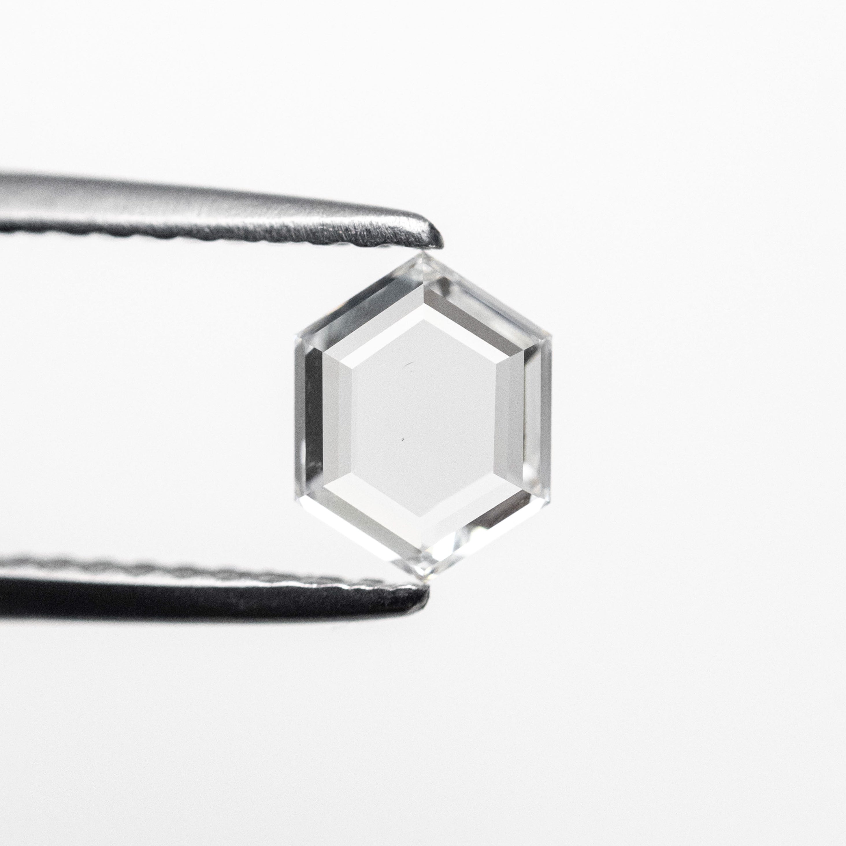 The 0.51ct 6.22x4.80x1.67mm SI1 F Hexagon Portrait Cut 19438-32 by East London jeweller Rachel Boston | Discover our collections of unique and timeless engagement rings, wedding rings, and modern fine jewellery.