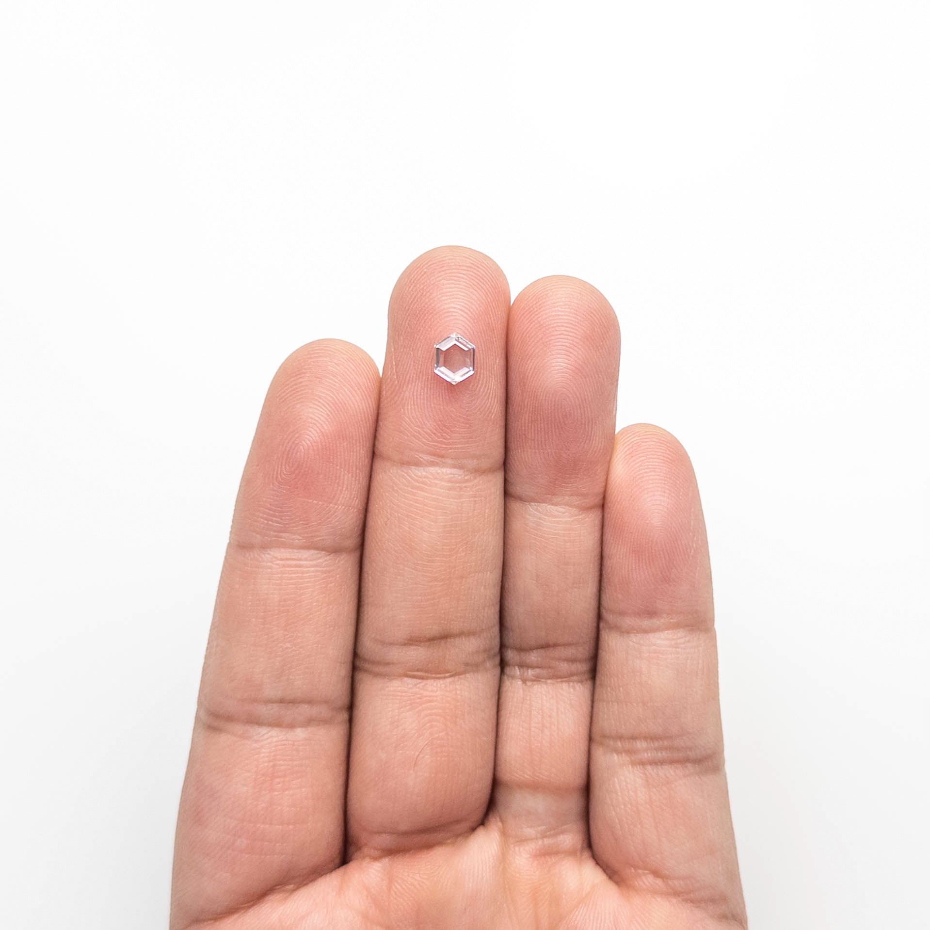 The 0.51ct 6.22x4.80x1.67mm SI1 F Hexagon Portrait Cut 19438-32 by East London jeweller Rachel Boston | Discover our collections of unique and timeless engagement rings, wedding rings, and modern fine jewellery.