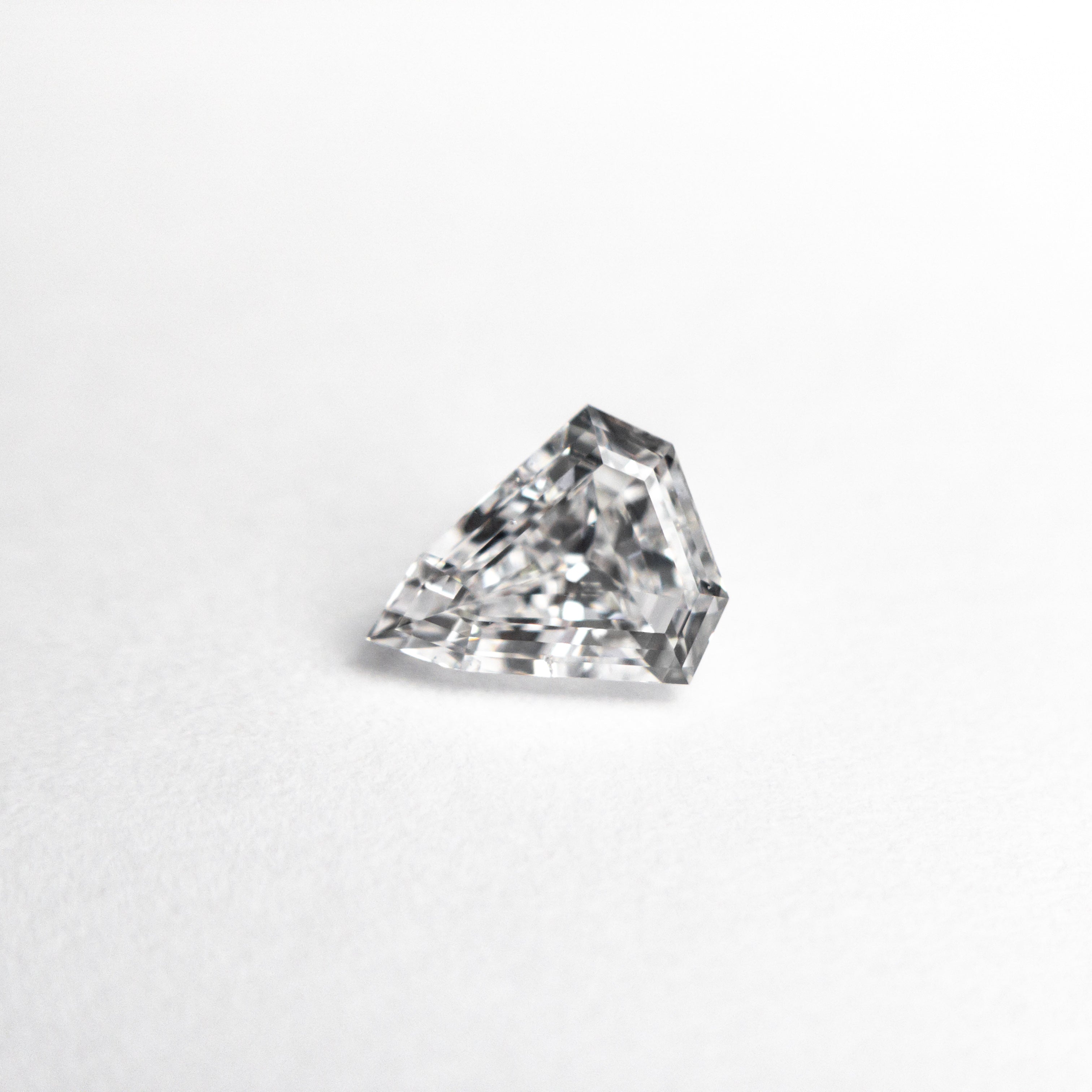 The 0.57ct 6.13x5.16x2.97mm SI2 D Shield Step Cut 19438-37 by East London jeweller Rachel Boston | Discover our collections of unique and timeless engagement rings, wedding rings, and modern fine jewellery.
