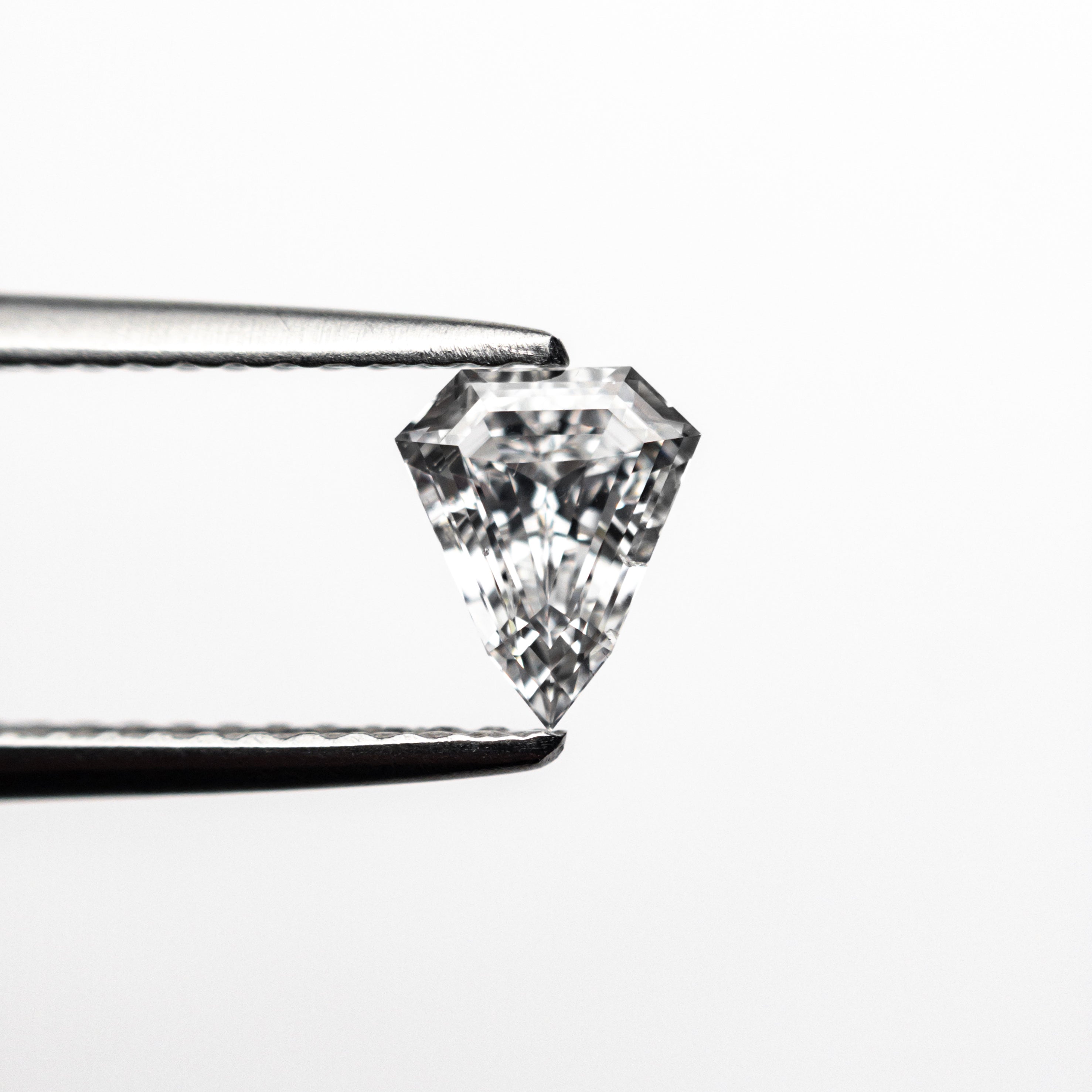 The 0.57ct 6.13x5.16x2.97mm SI2 D Shield Step Cut 19438-37 by East London jeweller Rachel Boston | Discover our collections of unique and timeless engagement rings, wedding rings, and modern fine jewellery.