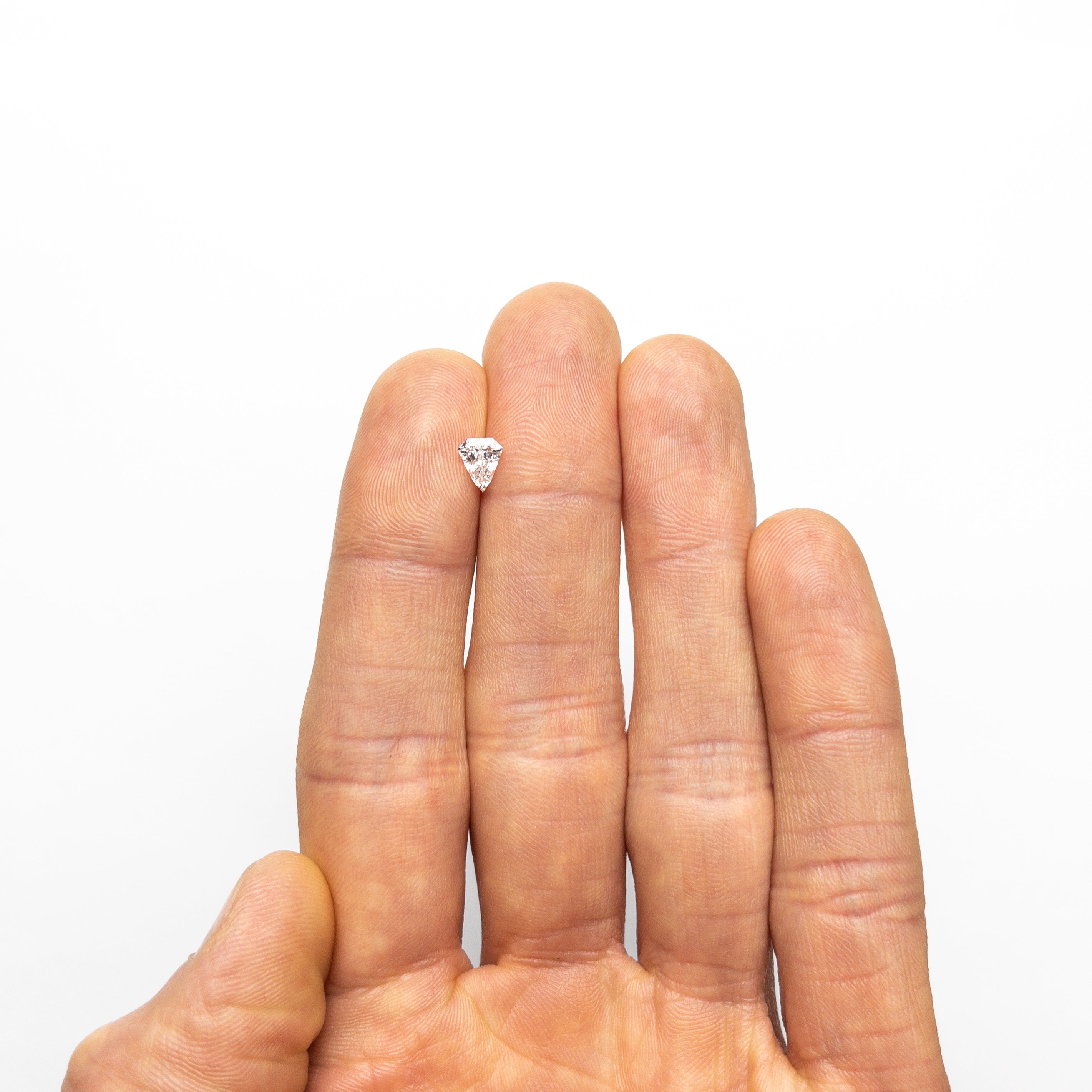 The 0.57ct 6.13x5.16x2.97mm SI2 D Shield Step Cut 19438-37 by East London jeweller Rachel Boston | Discover our collections of unique and timeless engagement rings, wedding rings, and modern fine jewellery.