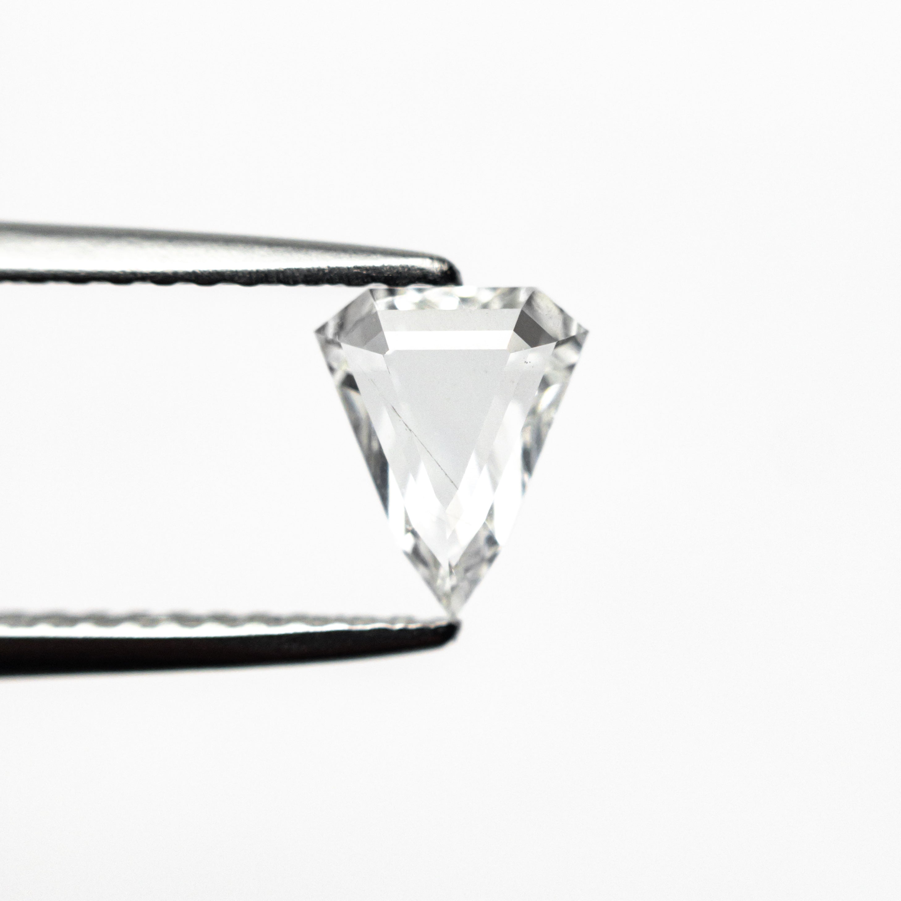 The 0.59ct 6.90x5.63x1.96mm SI2 F Shield Portrait Cut 19438-38 by East London jeweller Rachel Boston | Discover our collections of unique and timeless engagement rings, wedding rings, and modern fine jewellery.
