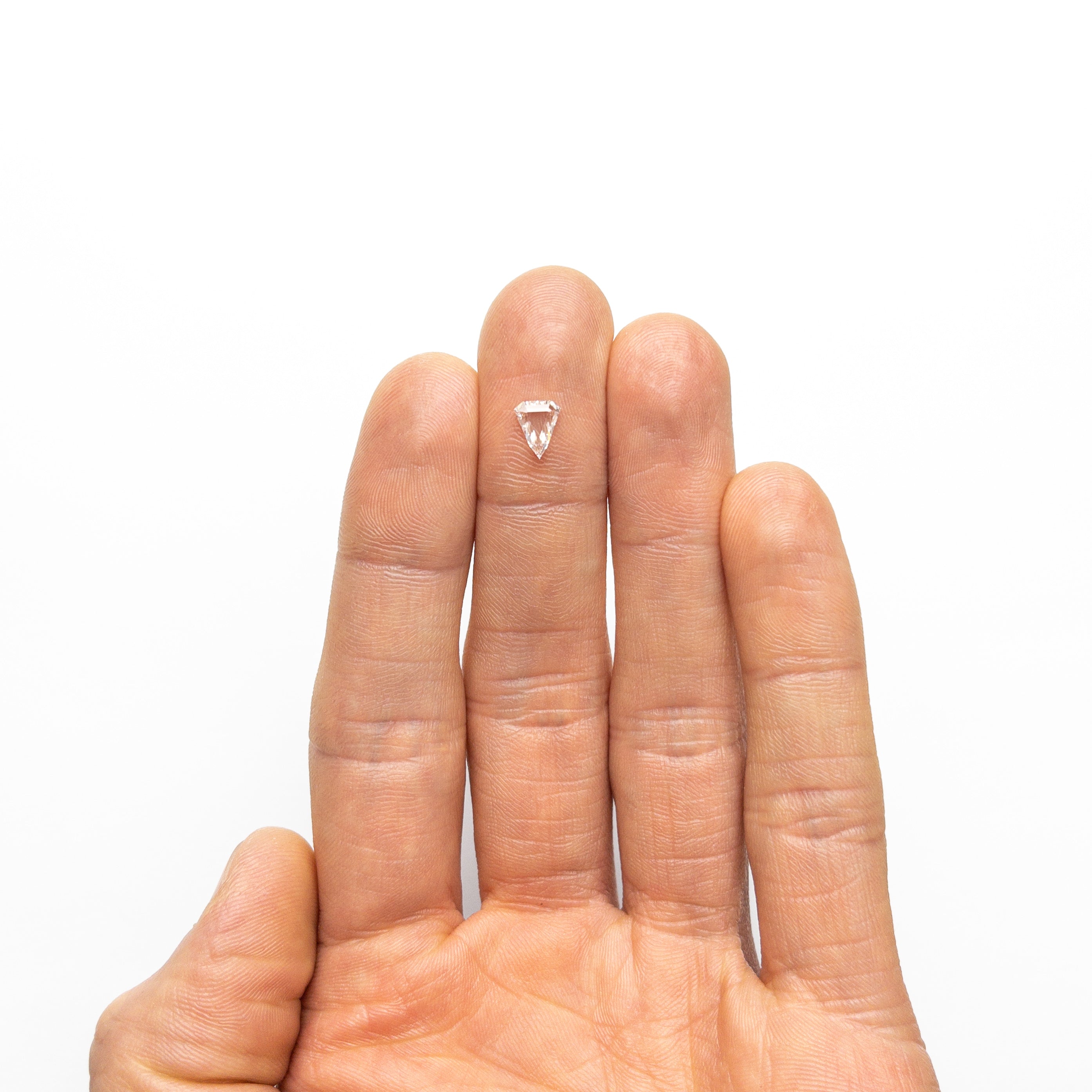 The 0.59ct 6.90x5.63x1.96mm SI2 F Shield Portrait Cut 19438-38 by East London jeweller Rachel Boston | Discover our collections of unique and timeless engagement rings, wedding rings, and modern fine jewellery.