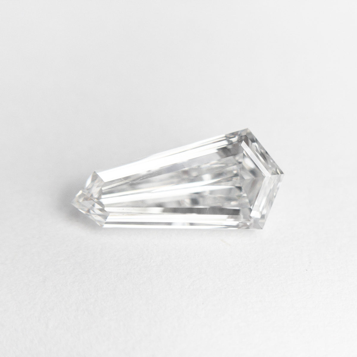 The 1.10ct 10.99x5.26x2.90mm GIA SI1 E Kite Step Cut 19488-01 by East London jeweller Rachel Boston | Discover our collections of unique and timeless engagement rings, wedding rings, and modern fine jewellery.
