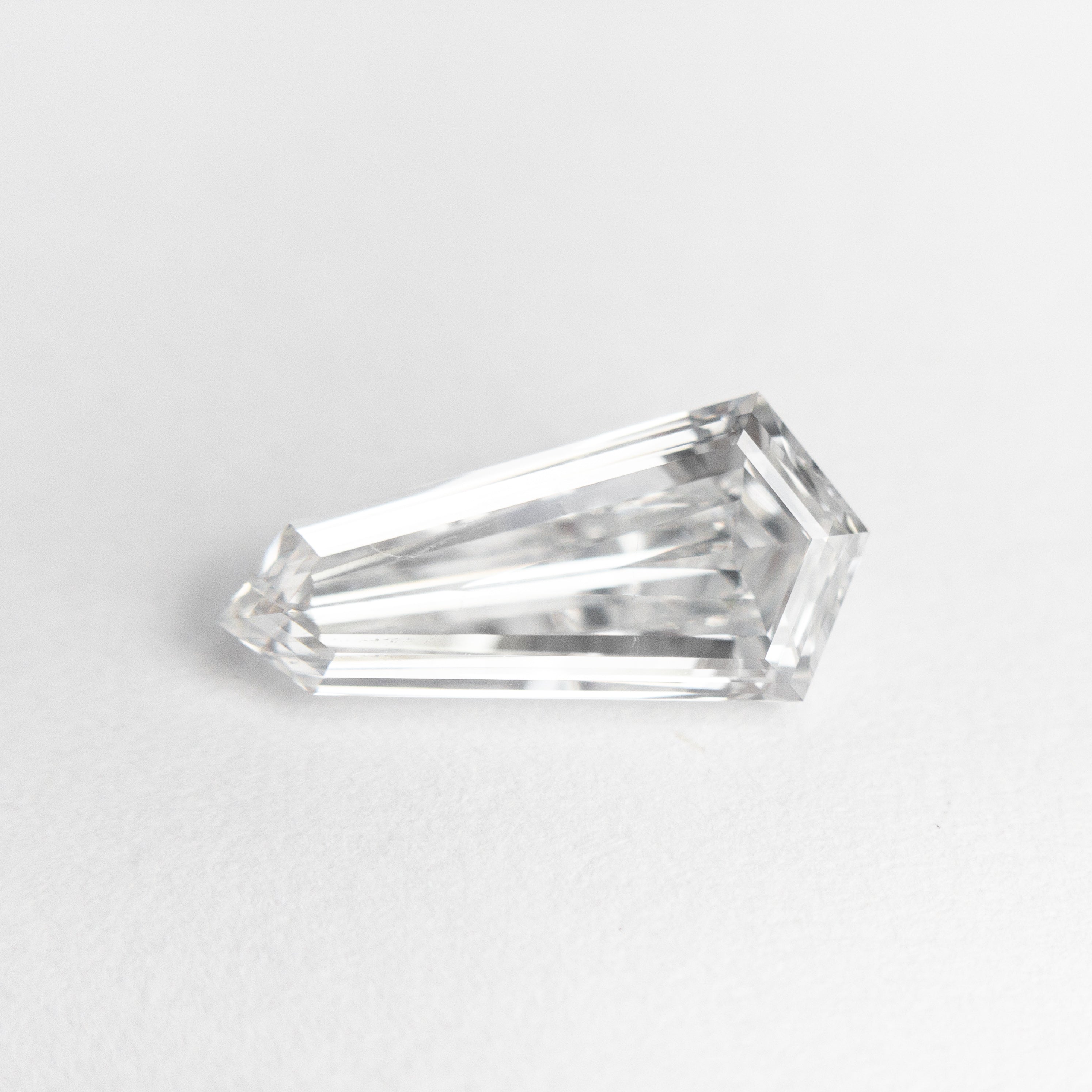 The 1.10ct 10.99x5.26x2.90mm GIA SI1 E Kite Step Cut 19488-01 by East London jeweller Rachel Boston | Discover our collections of unique and timeless engagement rings, wedding rings, and modern fine jewellery.