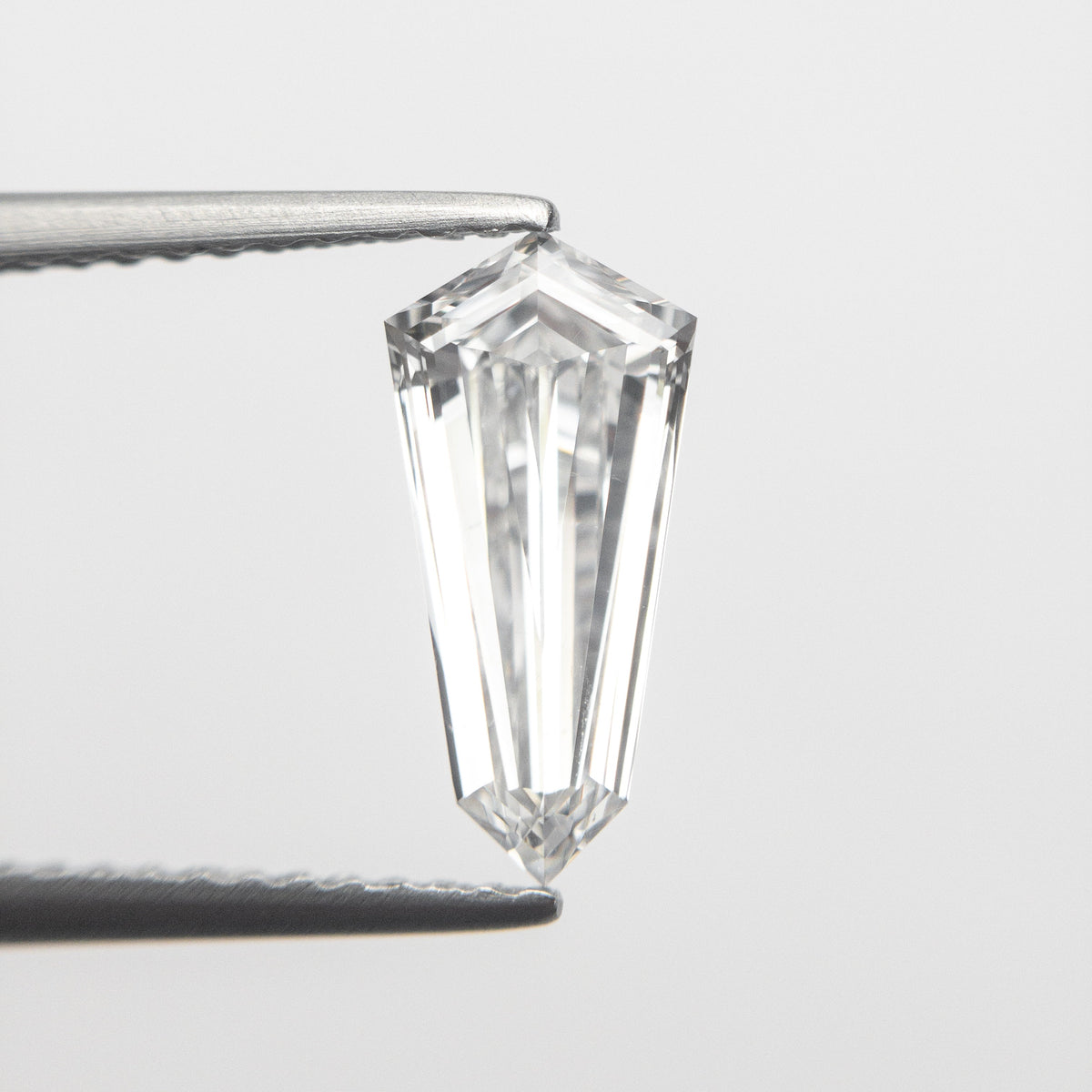 The 1.10ct 10.99x5.26x2.90mm GIA SI1 E Kite Step Cut 19488-01 by East London jeweller Rachel Boston | Discover our collections of unique and timeless engagement rings, wedding rings, and modern fine jewellery.