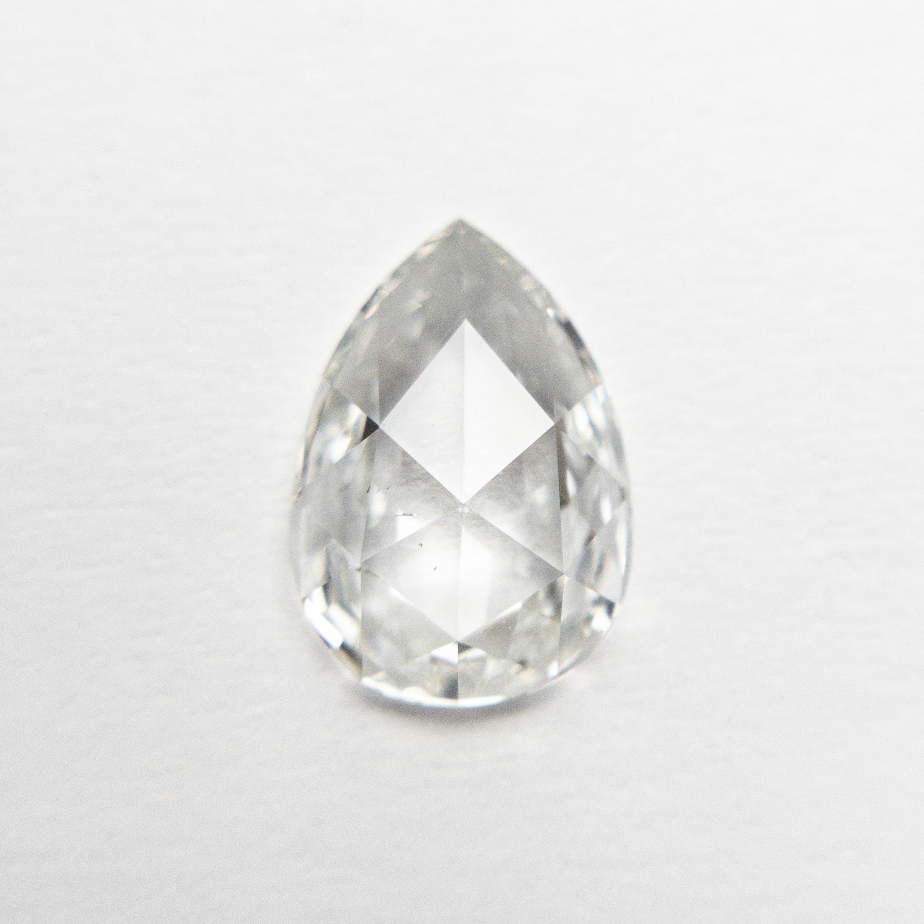 The 1.29ct 9.63x6.73x2.74mm SI1 G Pear Rosecut 19643-01 by East London jeweller Rachel Boston | Discover our collections of unique and timeless engagement rings, wedding rings, and modern fine jewellery.